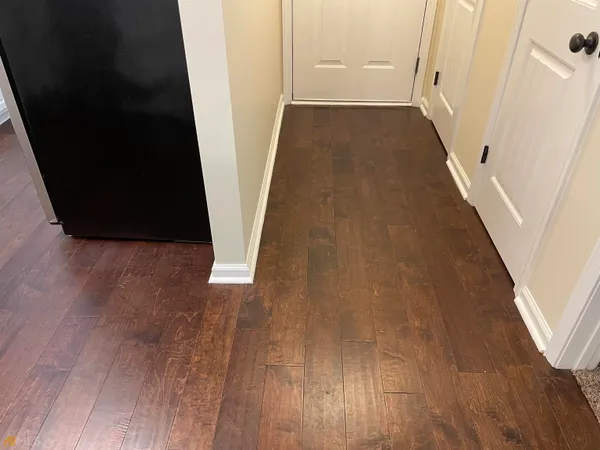 view of a hallway with wooden floor