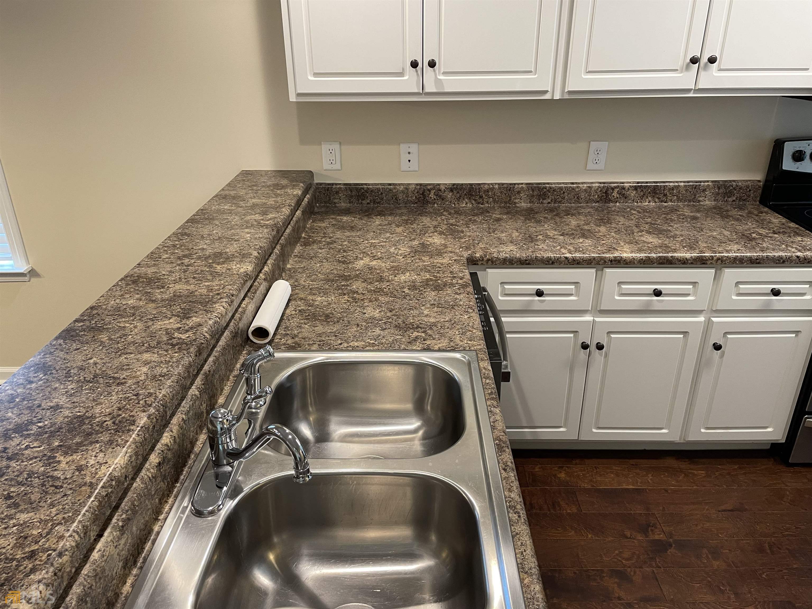 148 Buckhaven Way, Unit 148 Statesboro, GA 30458 - Photo 14 of 27 a close view of a stove top oven and cabinets