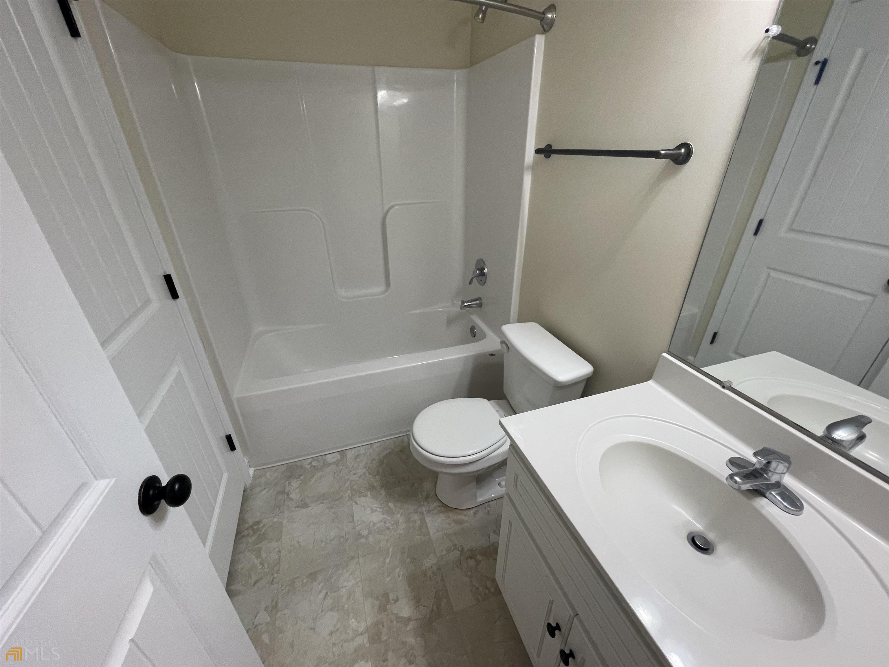 148 Buckhaven Way, Unit 148 Statesboro, GA 30458 - Photo 16 of 27 a bathroom with a sink toilet and shower