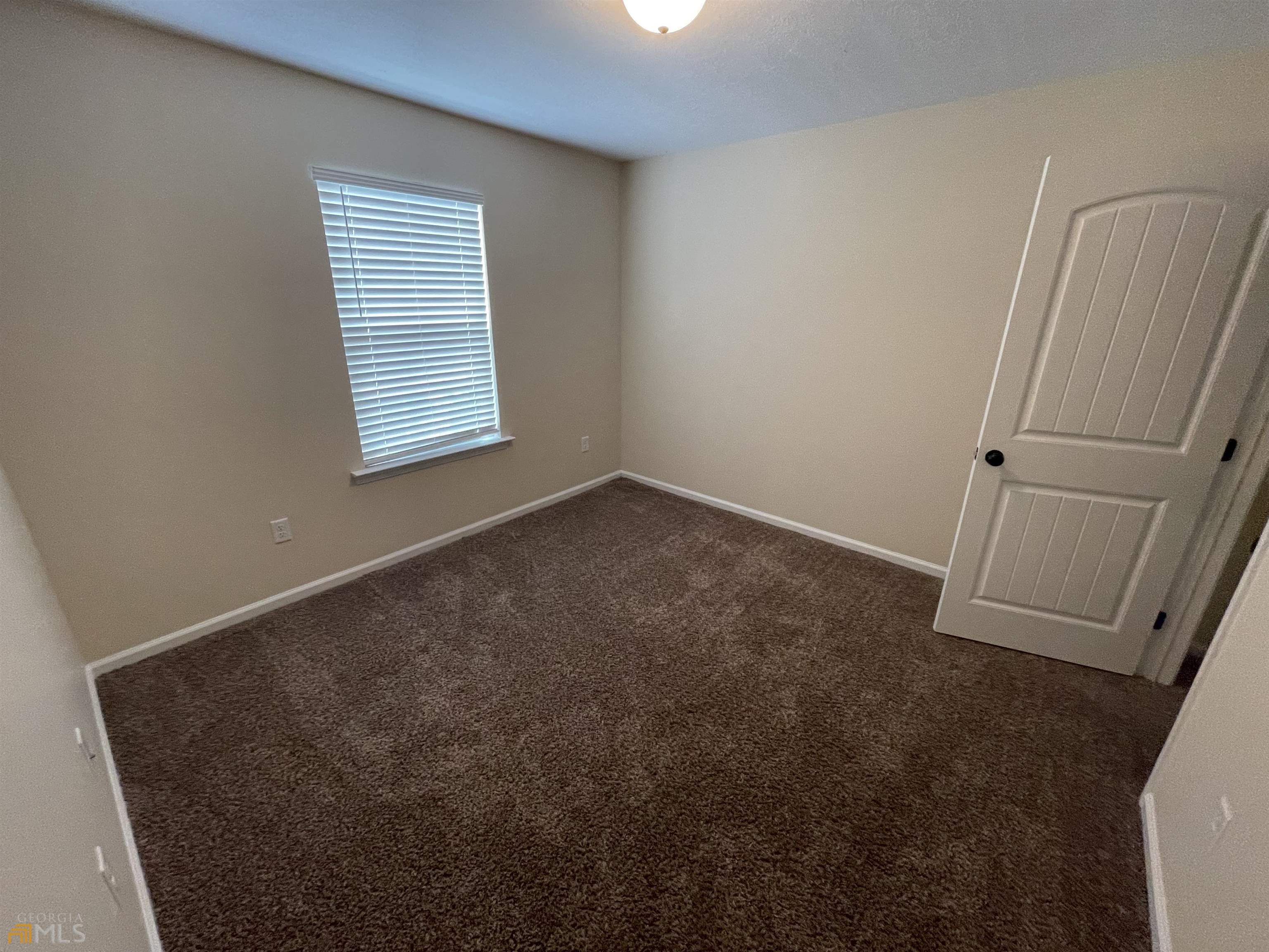 148 Buckhaven Way, Unit 148 Statesboro, GA 30458 - Photo 18 of 27 an empty room with windows