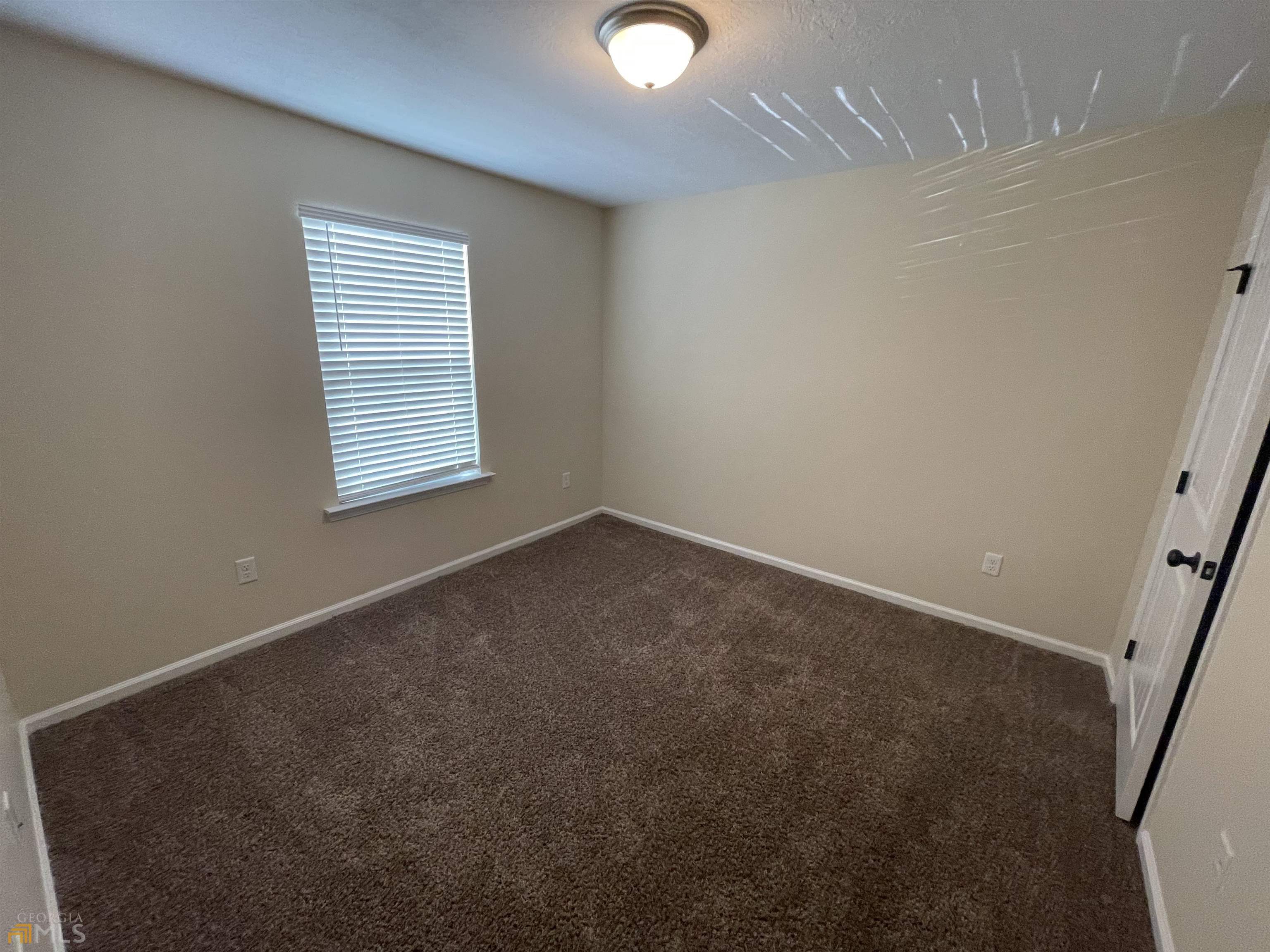 148 Buckhaven Way, Unit 148 Statesboro, GA 30458 - Photo 19 of 27 an empty room with a window