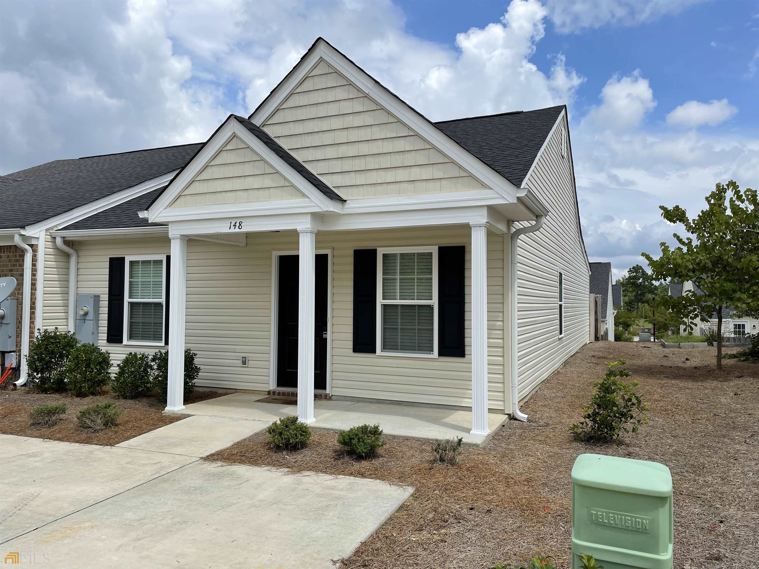 148 Buckhaven Way, Unit 148 Statesboro, GA 30458 - Photo 2 of 27 a front view of a house with garden