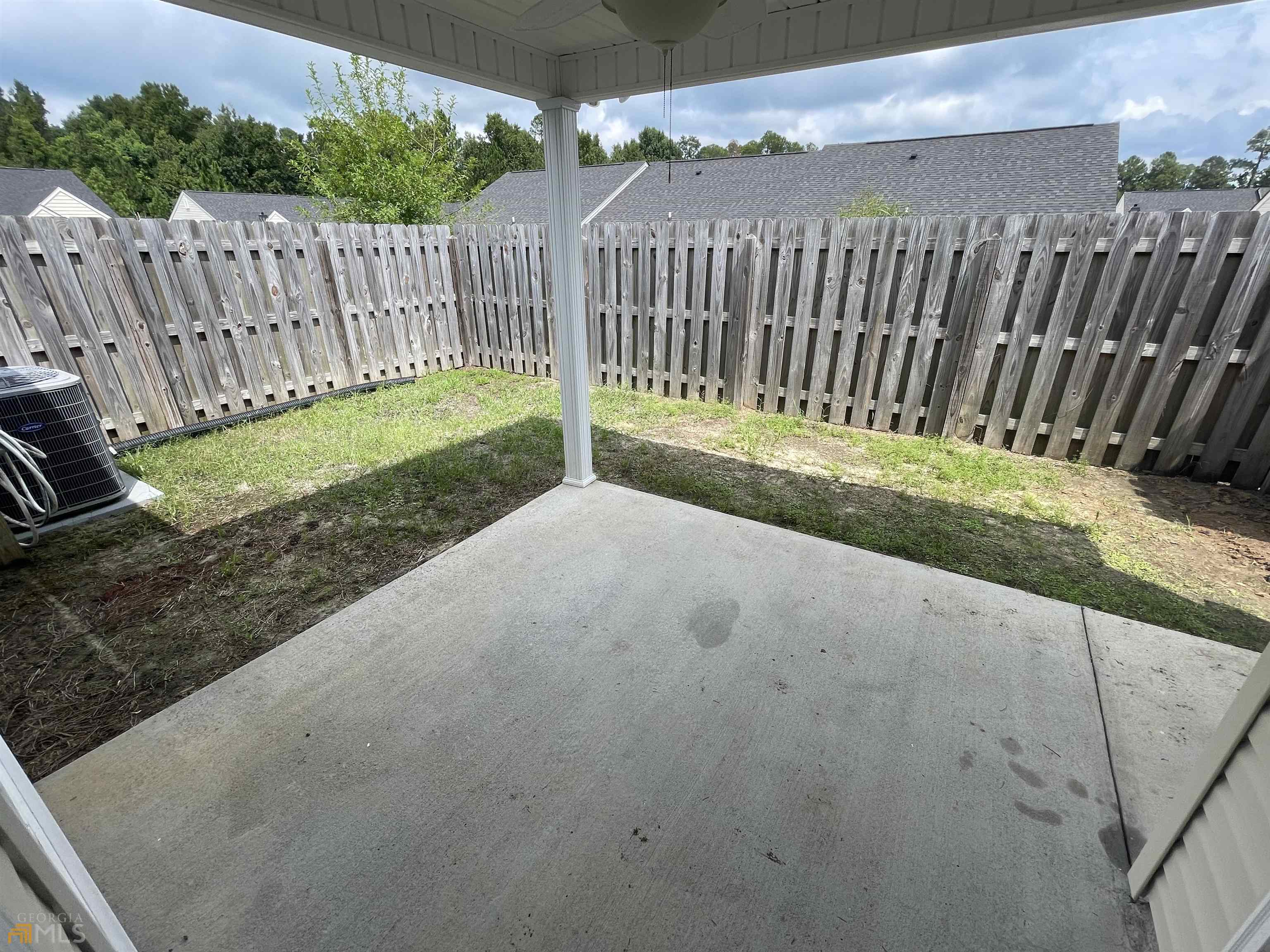 148 Buckhaven Way, Unit 148 Statesboro, GA 30458 - Photo 5 of 27 a view of backyard with wooden fence
