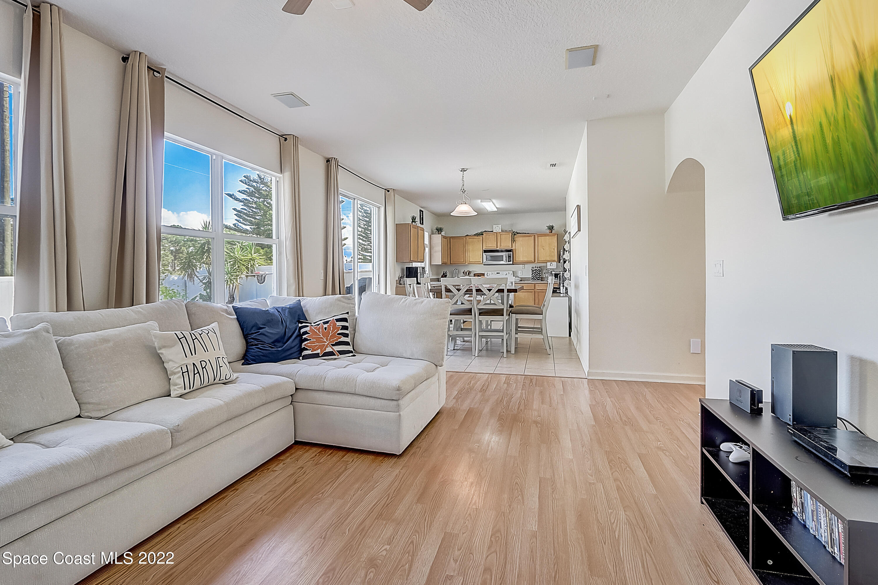 3687 Mt Carmel Lane Melbourne, FL 32901 - Photo 11 of 46 a living room with furniture and a flat screen tv