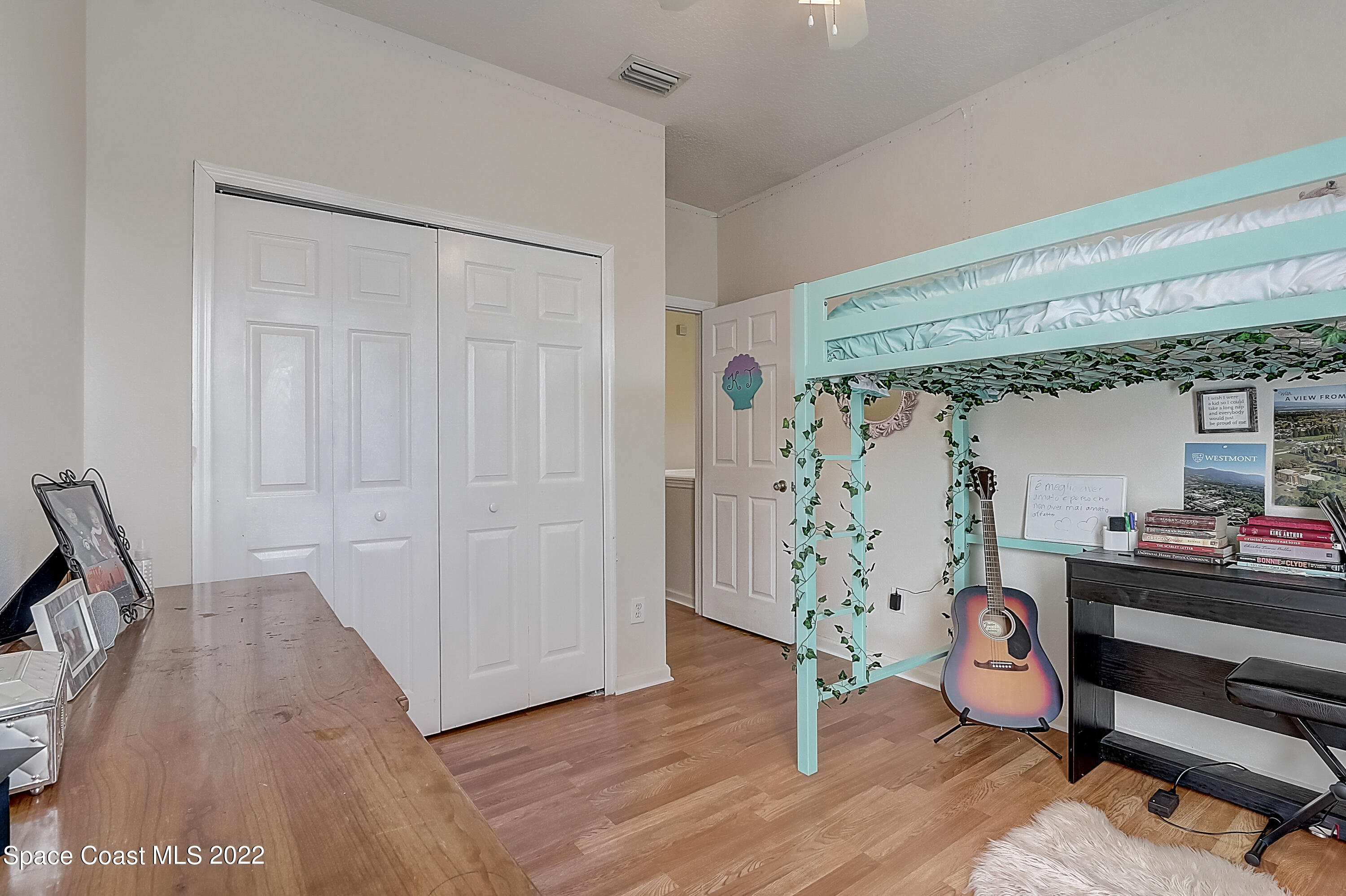 3687 Mt Carmel Lane Melbourne, FL 32901 - Photo 20 of 46 a bedroom with furniture and a window