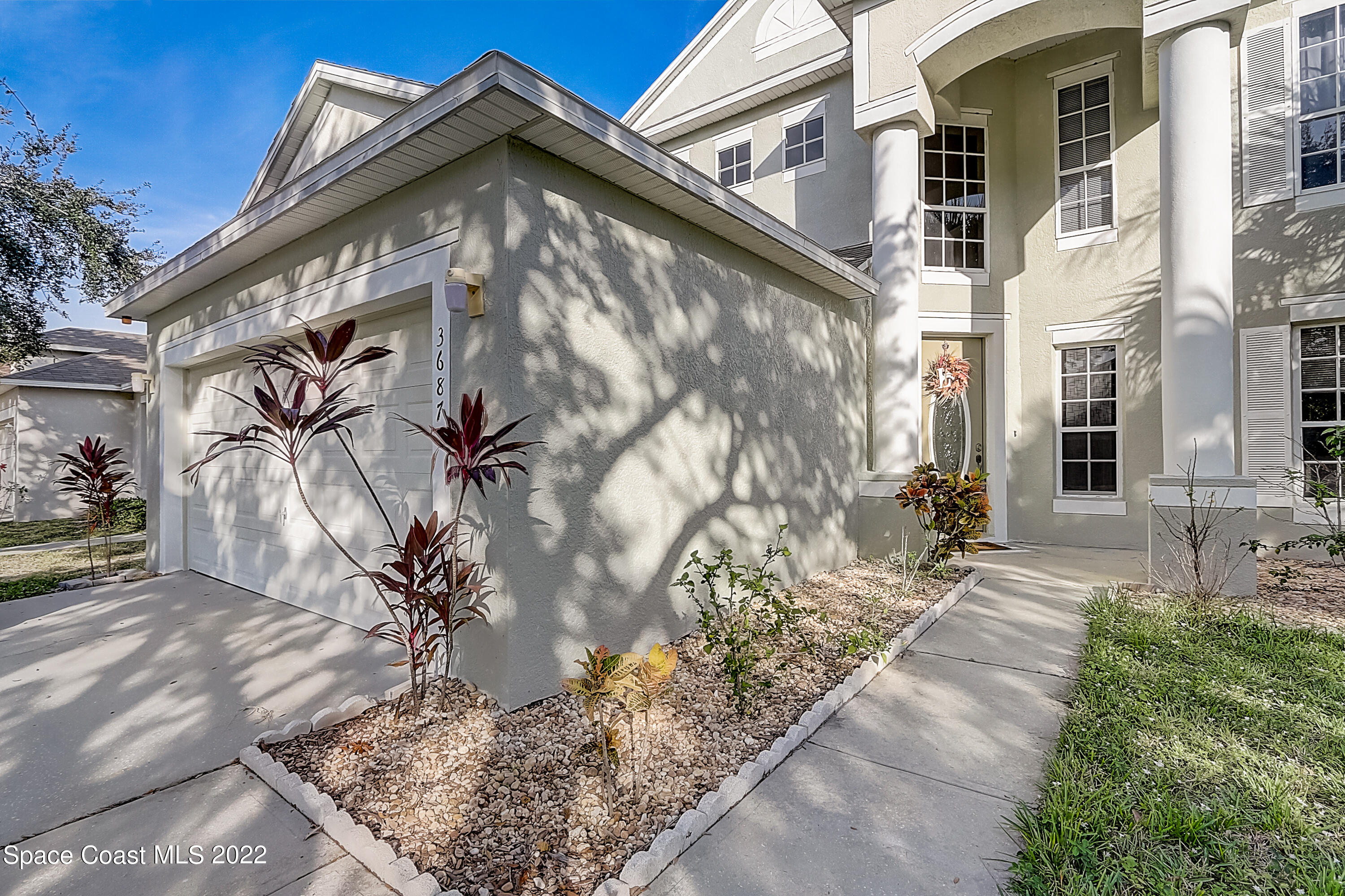 3687 Mt Carmel Lane Melbourne, FL 32901 - Photo 2 of 46 a view of a house with a yard