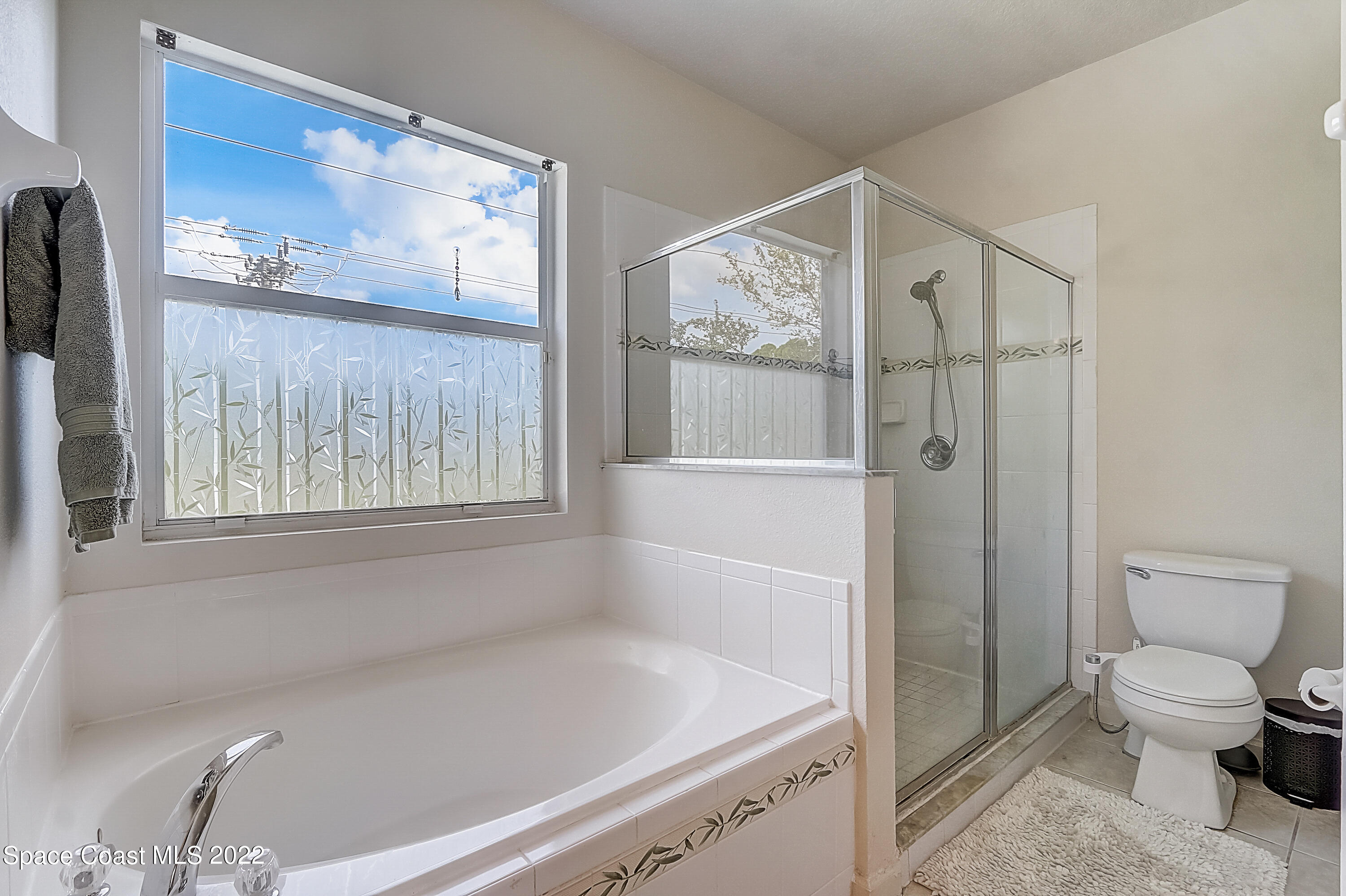 3687 Mt Carmel Lane Melbourne, FL 32901 - Photo 30 of 46 a bathroom with a toilet and a shower