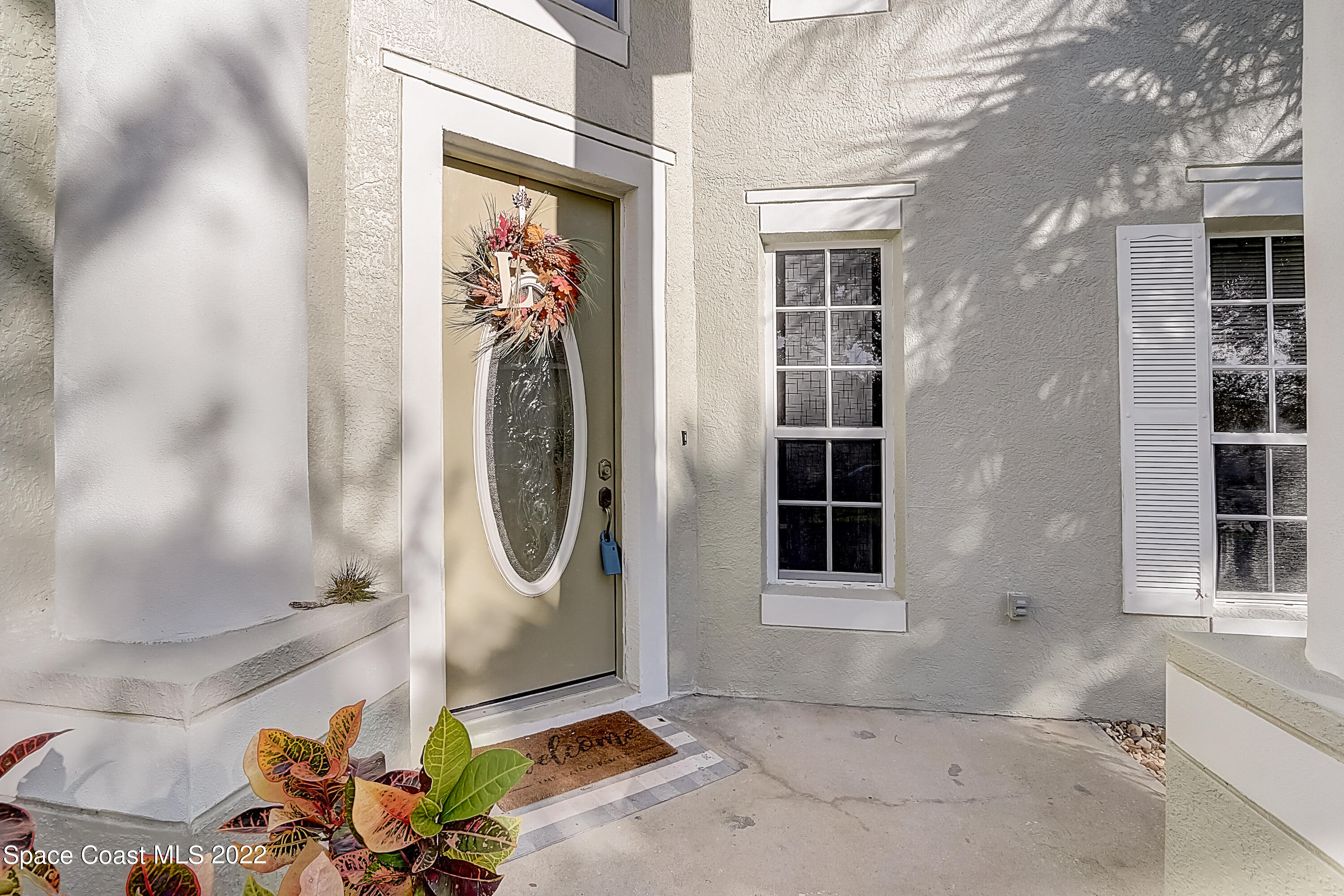 3687 Mt Carmel Lane Melbourne, FL 32901 - Photo 3 of 46 a front view of a house with a window