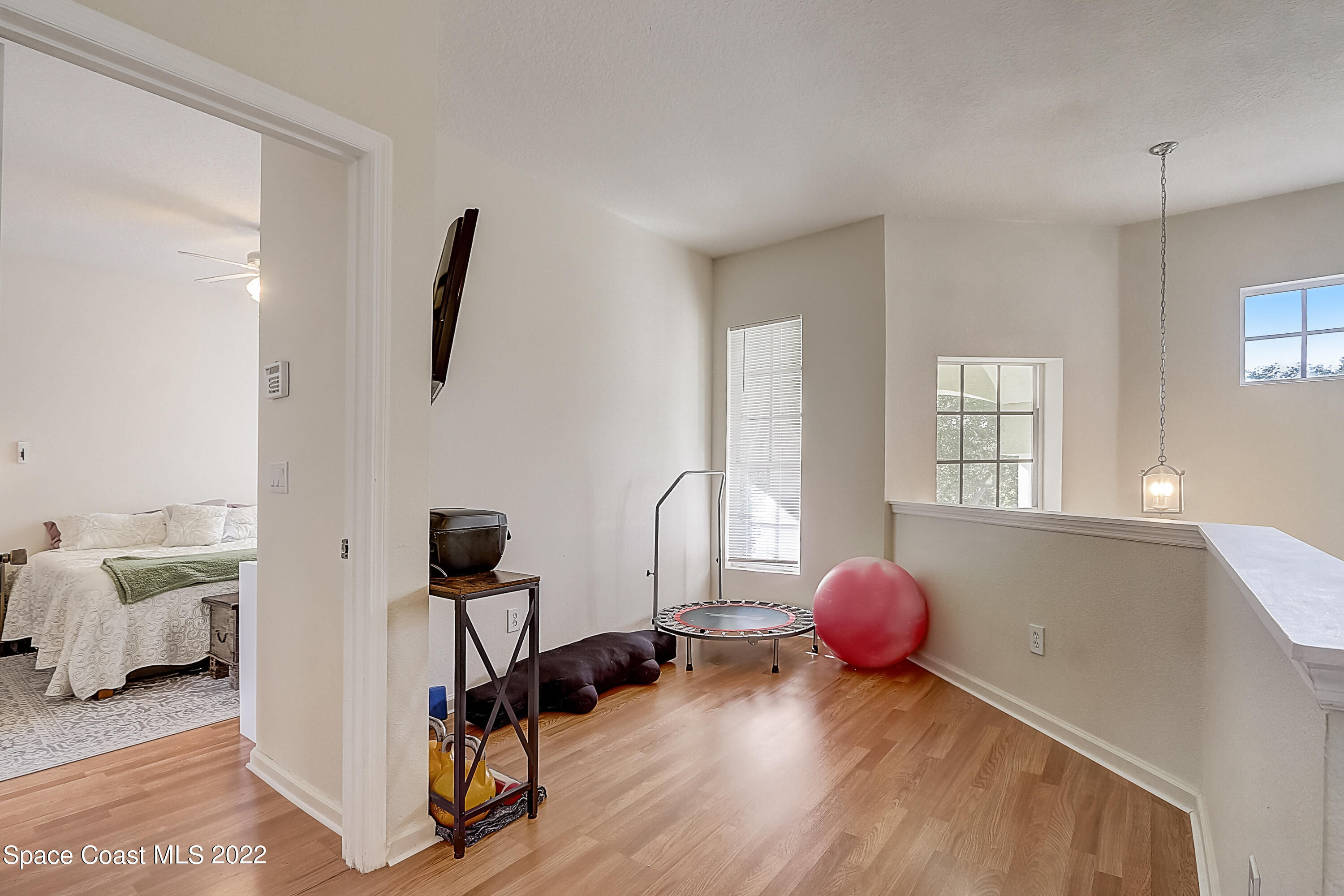 3687 Mt Carmel Lane Melbourne, FL 32901 - Photo 32 of 46 a bedroom with furniture and a window