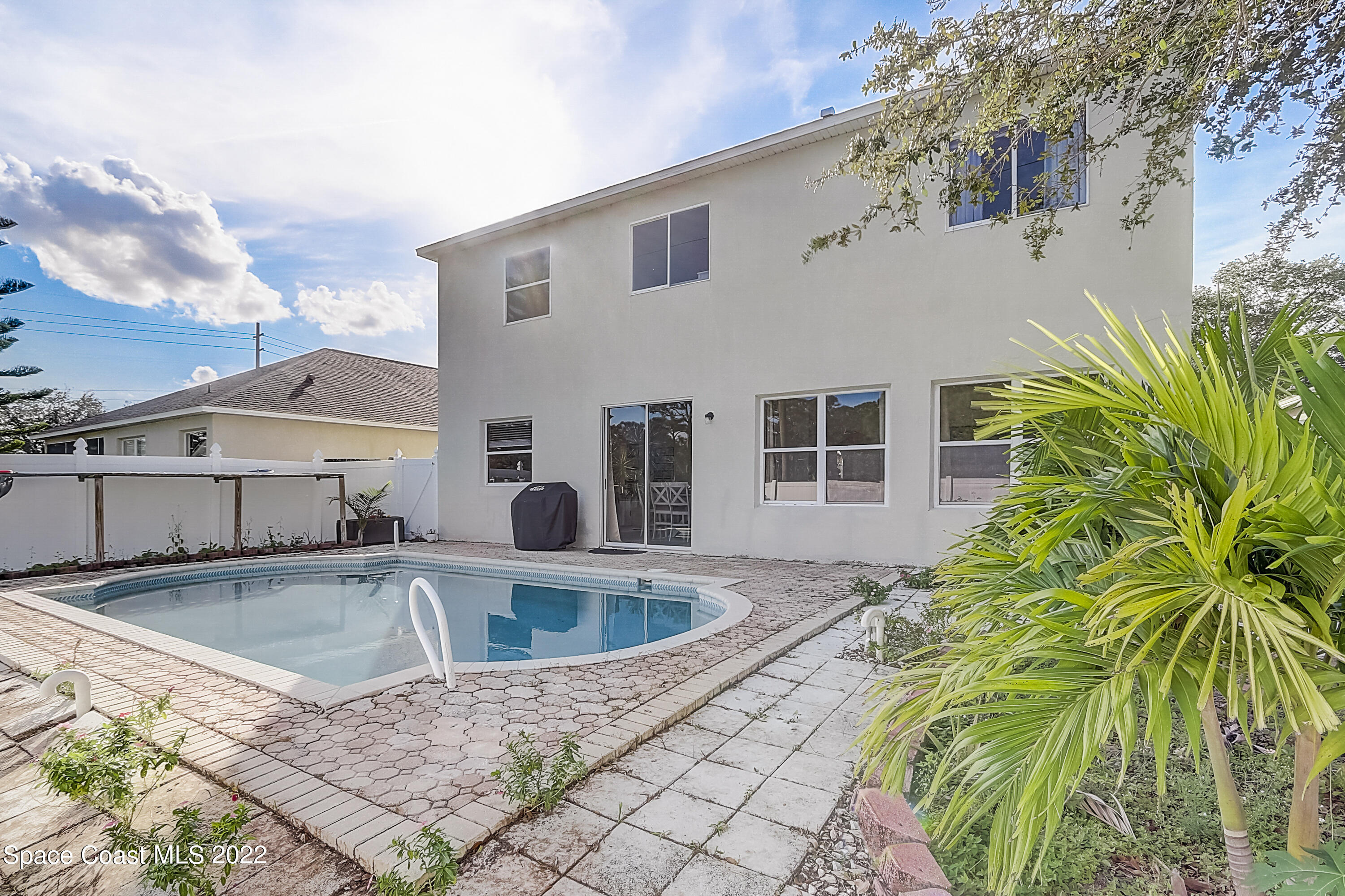 3687 Mt Carmel Lane Melbourne, FL 32901 - Photo 42 of 46 a front view of a house with a yard