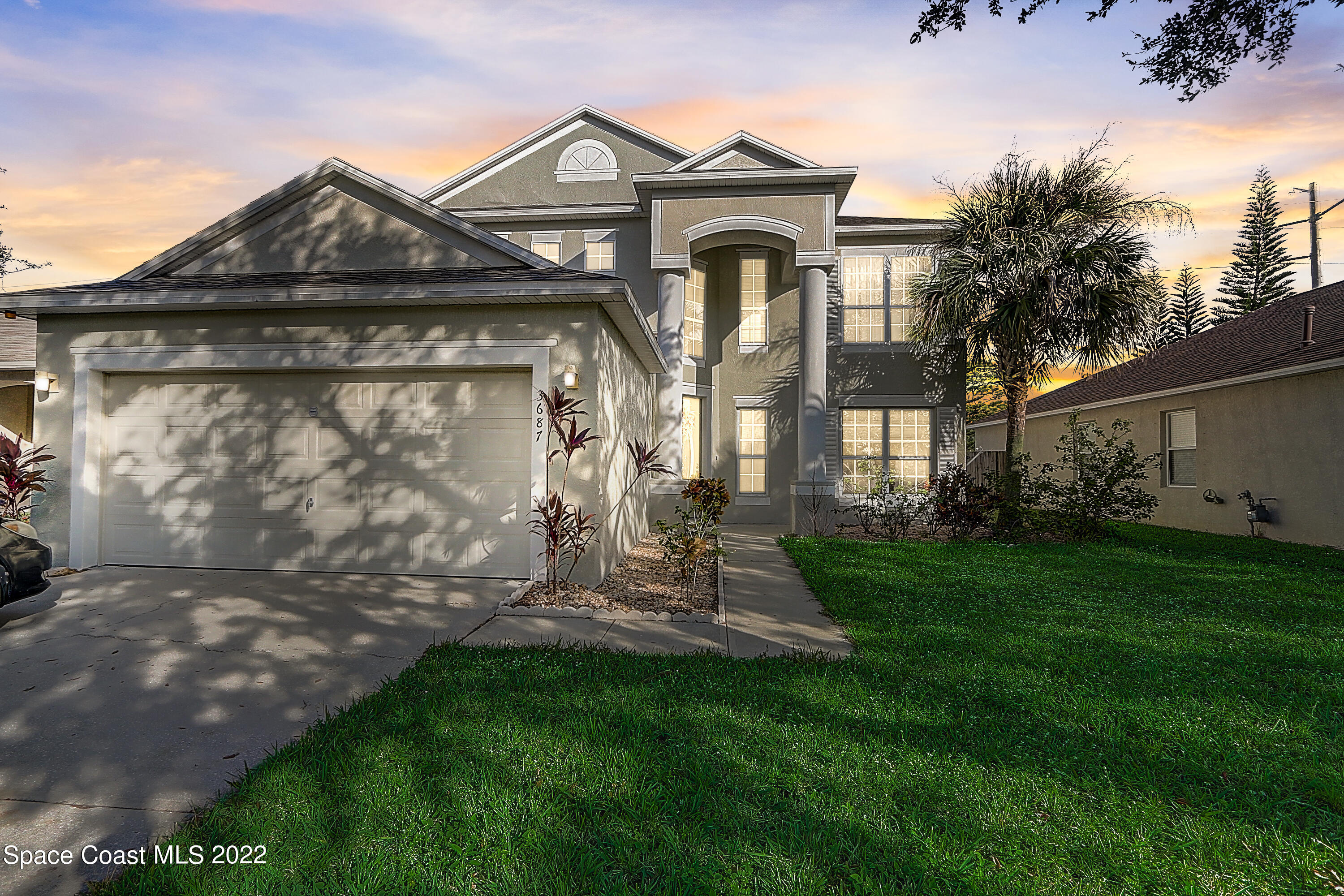 3687 Mt Carmel Lane Melbourne, FL 32901 - Photo 45 of 46 a front view of a house with garden