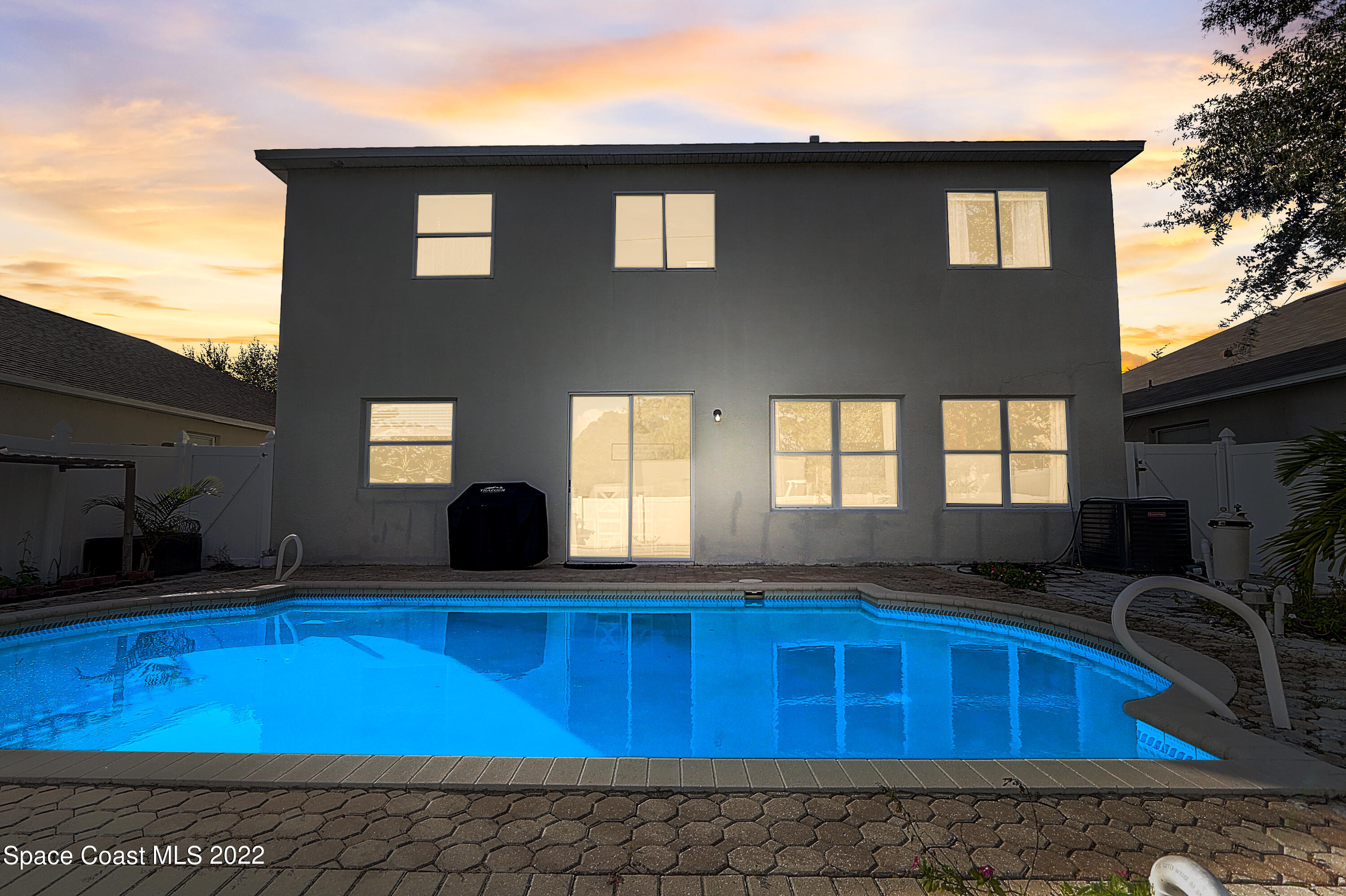 3687 Mt Carmel Lane Melbourne, FL 32901 - Photo 46 of 46 a view of a house with pool and wooden floor
