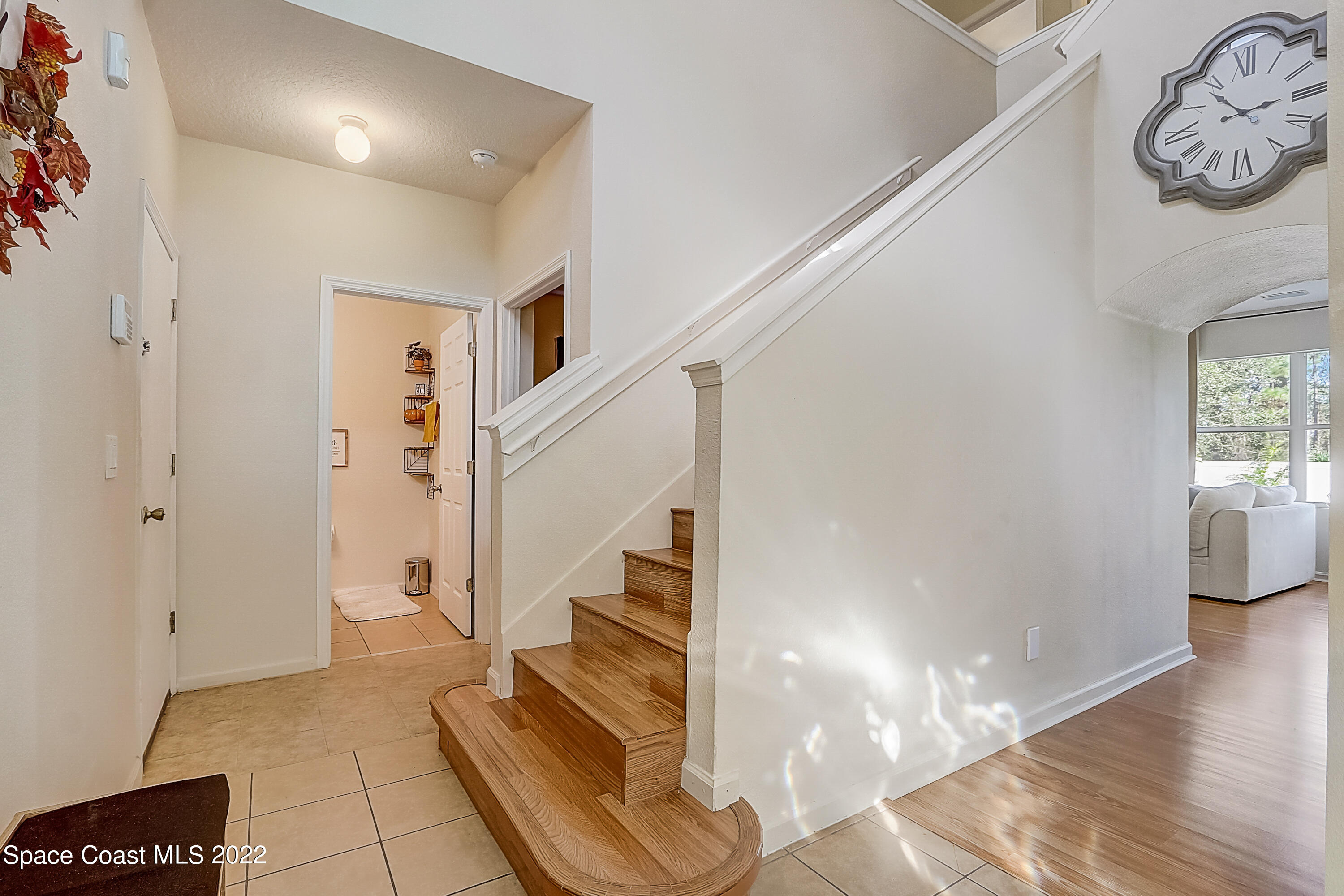 3687 Mt Carmel Lane Melbourne, FL 32901 - Photo 9 of 46 a view of entryway and hall with wooden floor