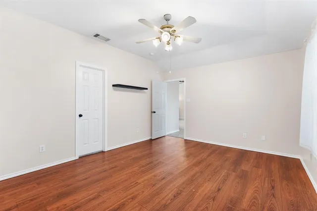 a bathroom with a bathtub a sink and a window