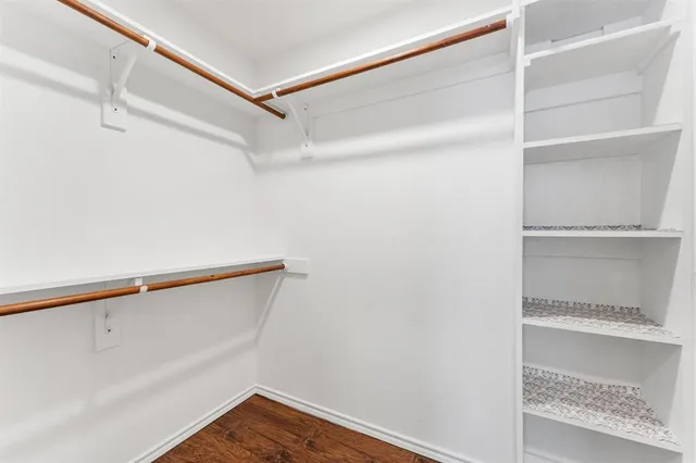 a backyard of a house with a large tree