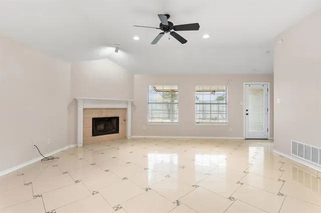 a view of an empty room with a fireplace