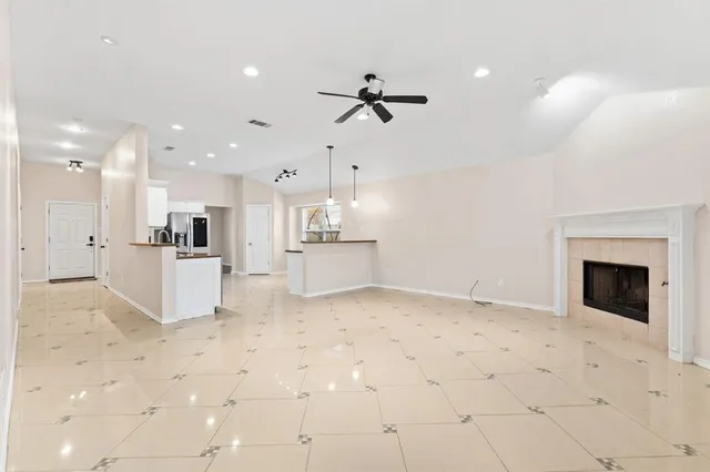 a kitchen with granite countertop a sink and a stove top oven