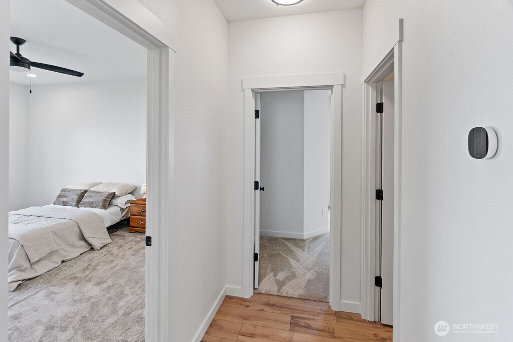 231 Shrute Road Prosser, WA 99350 - Photo 12 of 36 a bedroom with a bed and a mirror