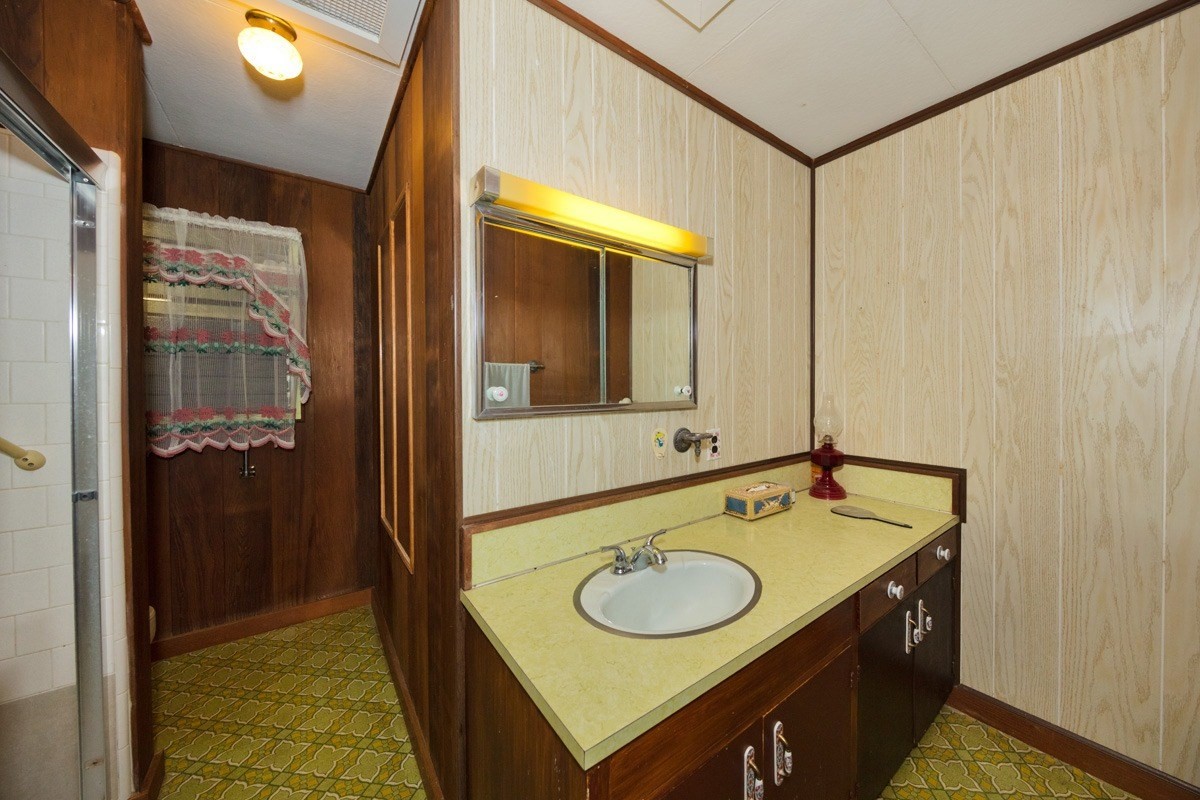 25 Kaapuni Loop Hilo, HI 96720 - Photo 15 of 25 a bathroom with a sink and a mirror