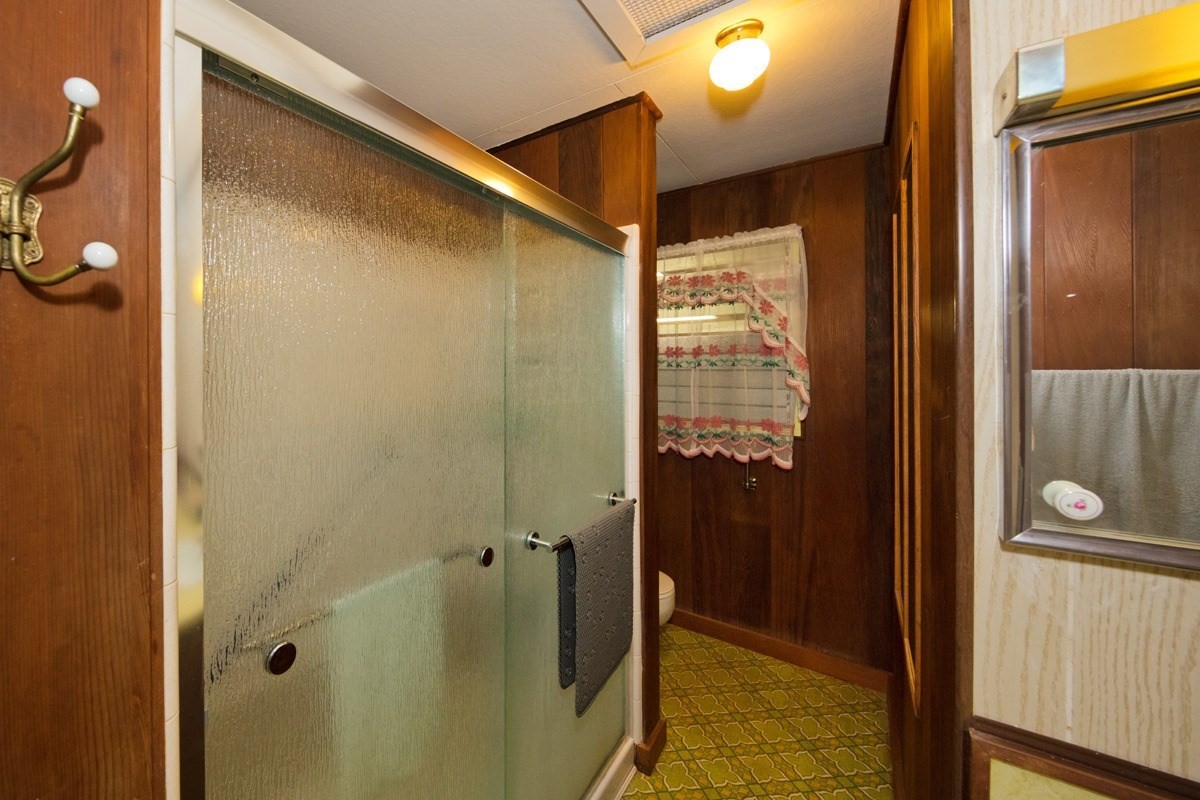 25 Kaapuni Loop Hilo, HI 96720 - Photo 16 of 25 a bathroom with a shower and a sink