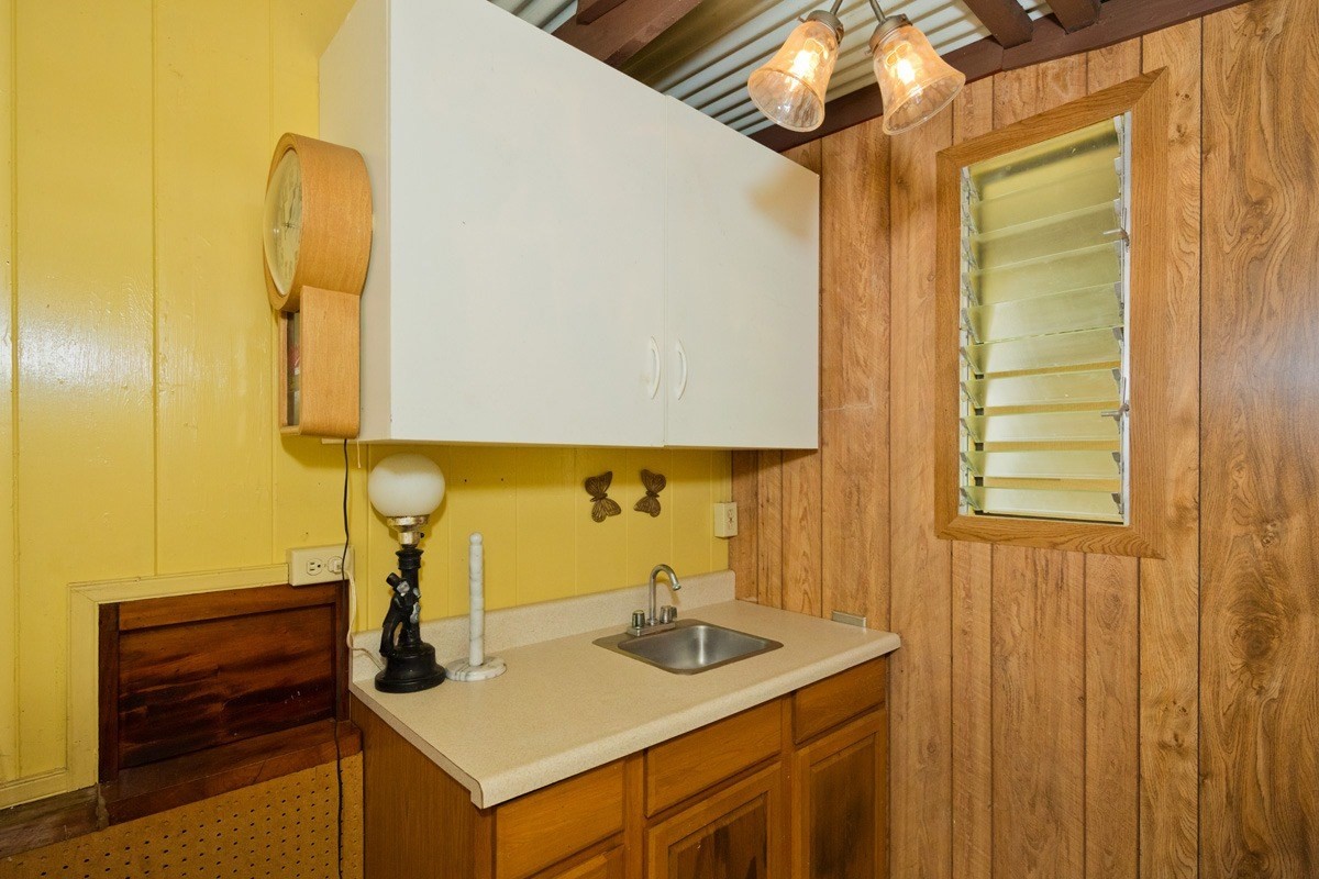 25 Kaapuni Loop Hilo, HI 96720 - Photo 21 of 25 a bathroom with a sink and a mirror