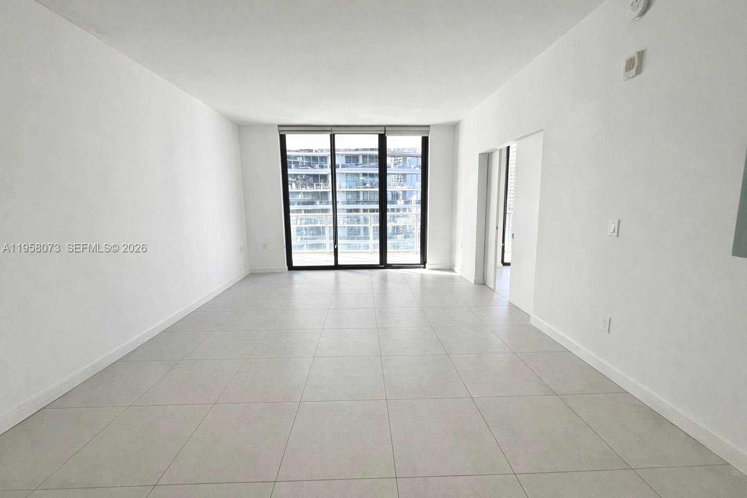 1010 Brickell Avenue, Unit 3207 Miami, FL 33131 - Photo 2 of 33 a view of an empty room with a window