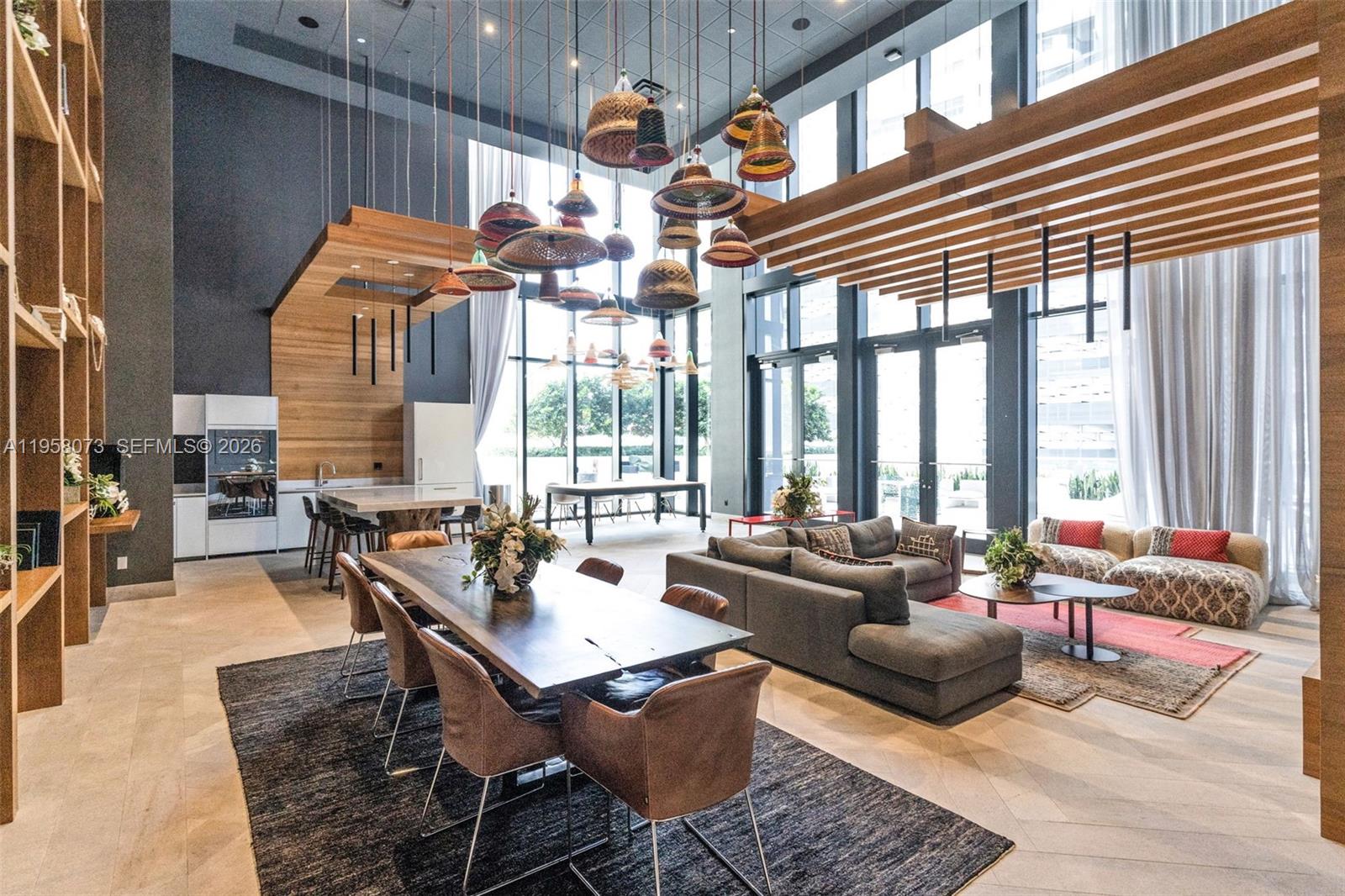 1010 Brickell Avenue, Unit 3207 Miami, FL 33131 - Photo 26 of 33 a dining room with furniture and large windows