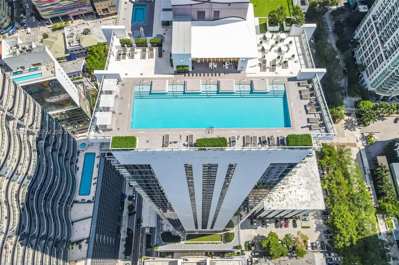 1010 Brickell Avenue, Unit 3207 Miami, FL 33131 - Photo 32 of 33 a view of a swimming pool with outdoor space and seating area