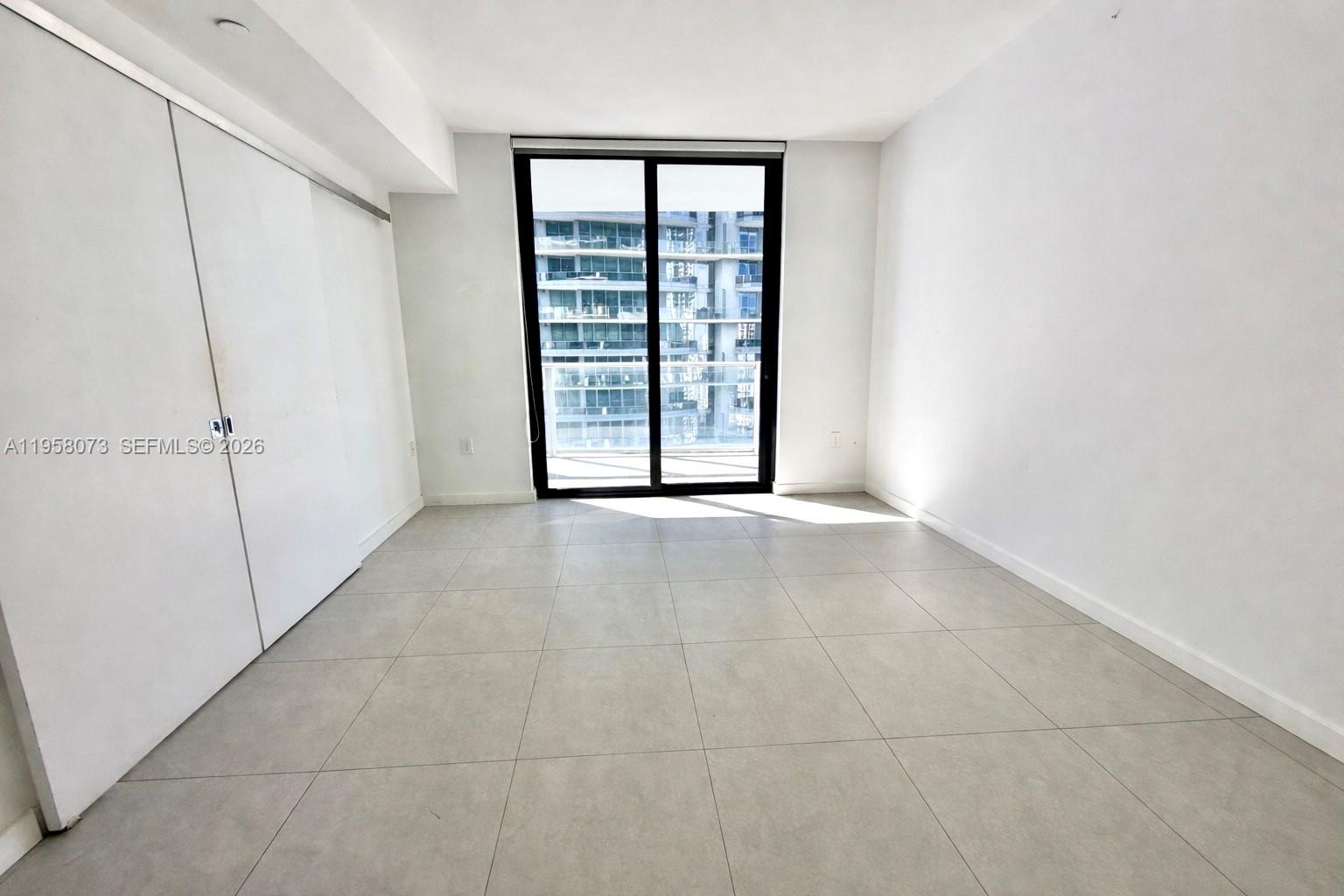 1010 Brickell Avenue, Unit 3207 Miami, FL 33131 - Photo 4 of 33 a view of an empty room with a window