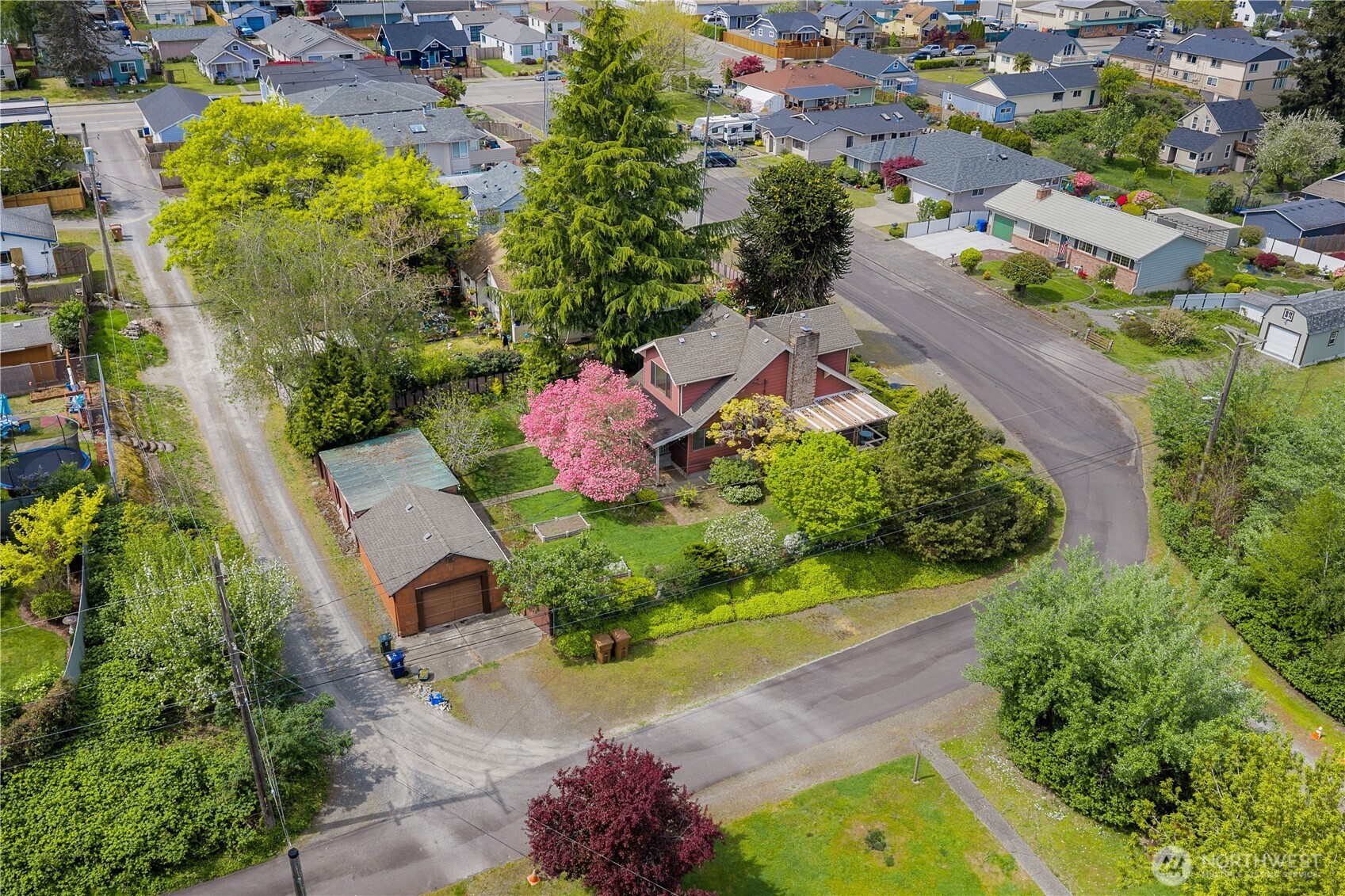 5704 North Ruby Street Tacoma, WA 98407 - Photo 4 of 38 an aerial view of a house with a garden