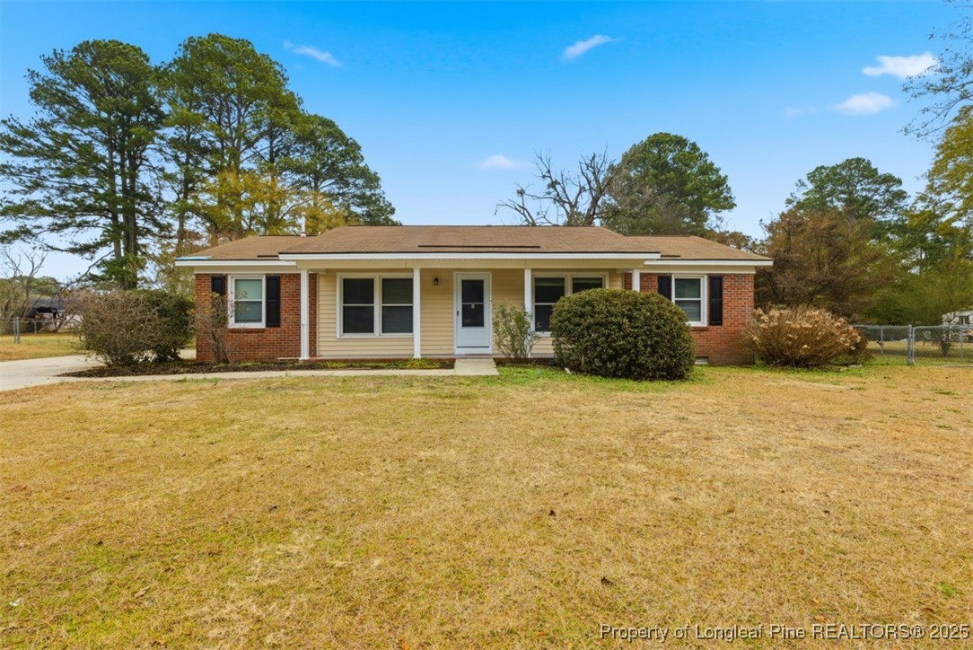 1109 Strickland Bridge Road Fayetteville, NC 28304 - Photo 1 of 20 a front view of house with yard and trees around