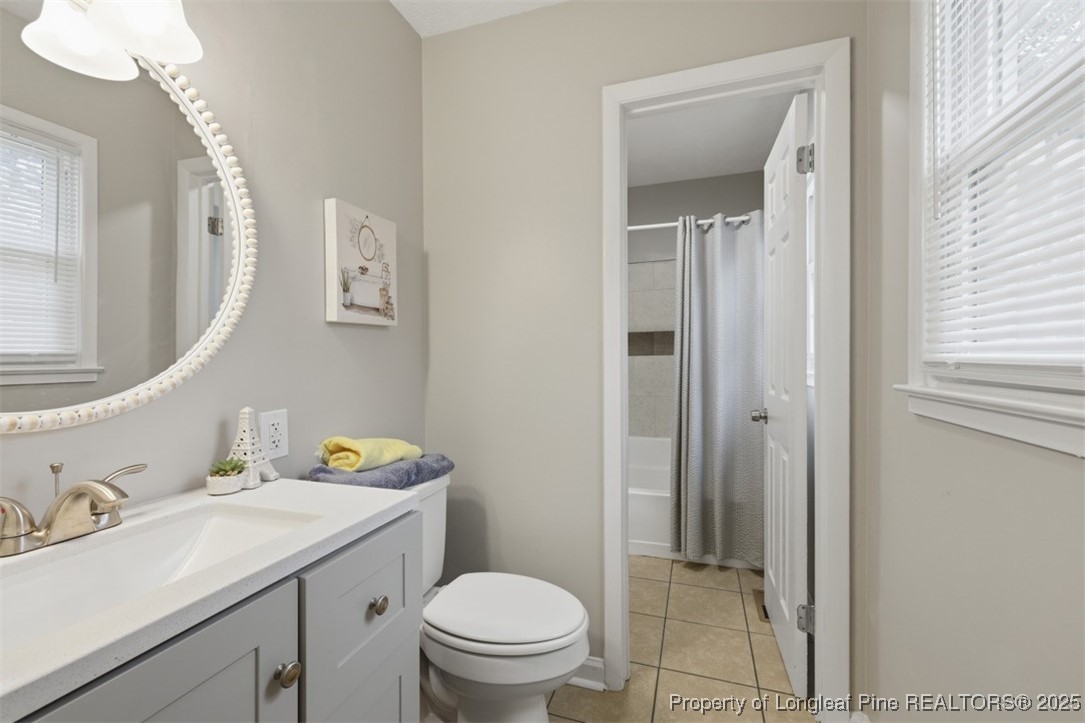 1109 Strickland Bridge Road Fayetteville, NC 28304 - Photo 12 of 20 a bathroom with a sink toilet and vanity