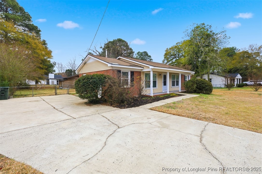 1109 Strickland Bridge Road Fayetteville, NC 28304 - Photo 16 of 20 a front view of a house with a yard