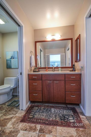 637 Randall Street Ridgecrest, CA 93555 - Photo 18 of 32 a bathroom with a sink a vanity and a mirror