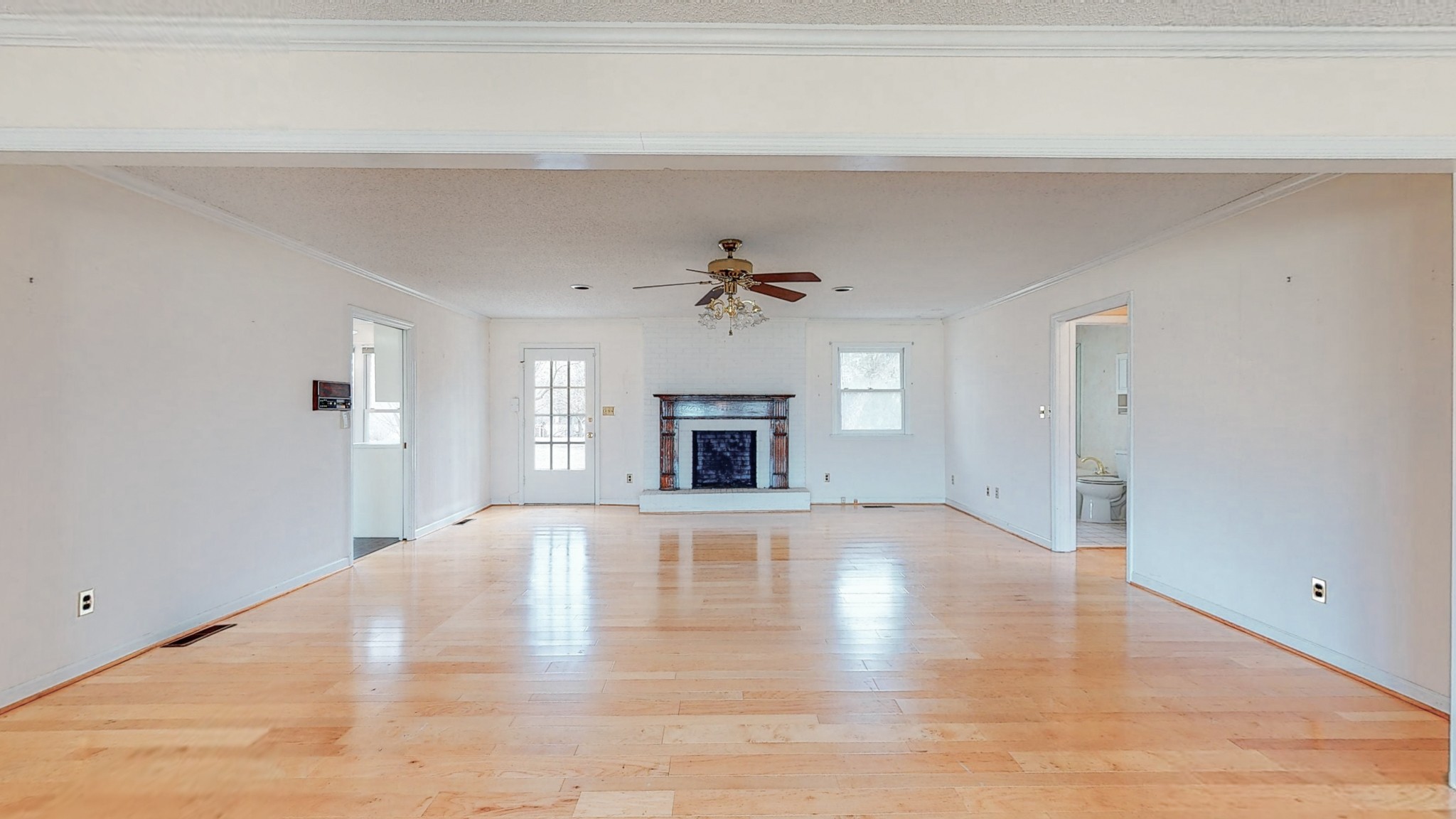 2165 Palmer Road Lebanon, TN 37090 - Photo 11 of 67 a view of an empty room with a fireplace and a window