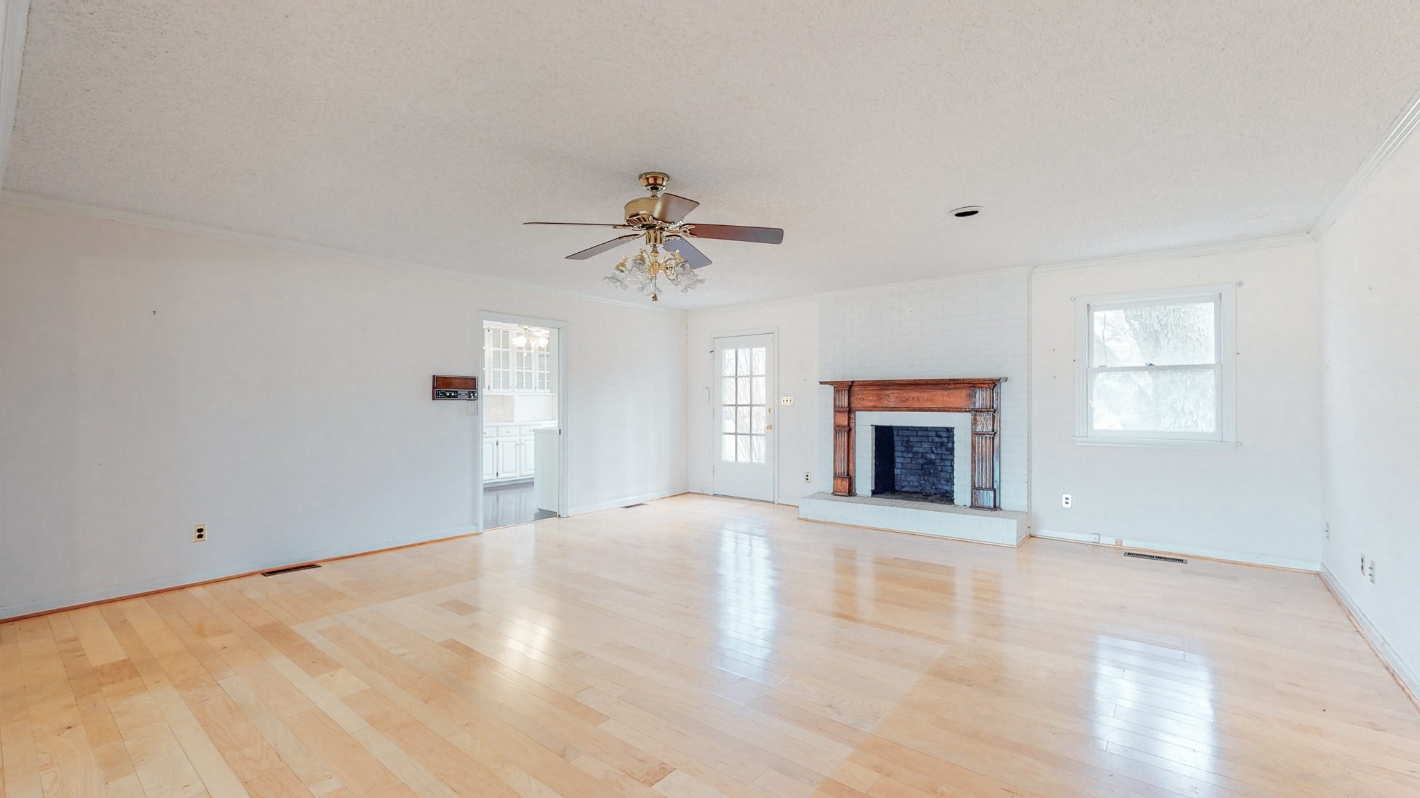 2165 Palmer Road Lebanon, TN 37090 - Photo 13 of 67 a view of an empty room with a fireplace and a window