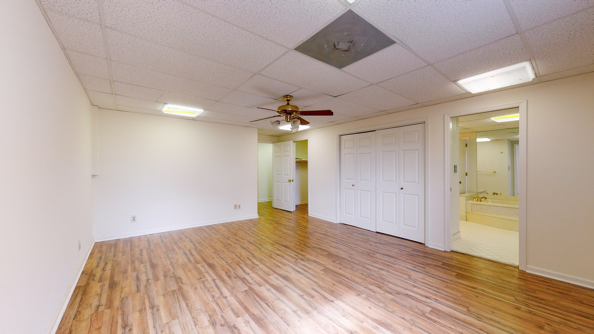 2165 Palmer Road Lebanon, TN 37090 - Photo 38 of 67 an empty room with wooden floor and a ceiling fan