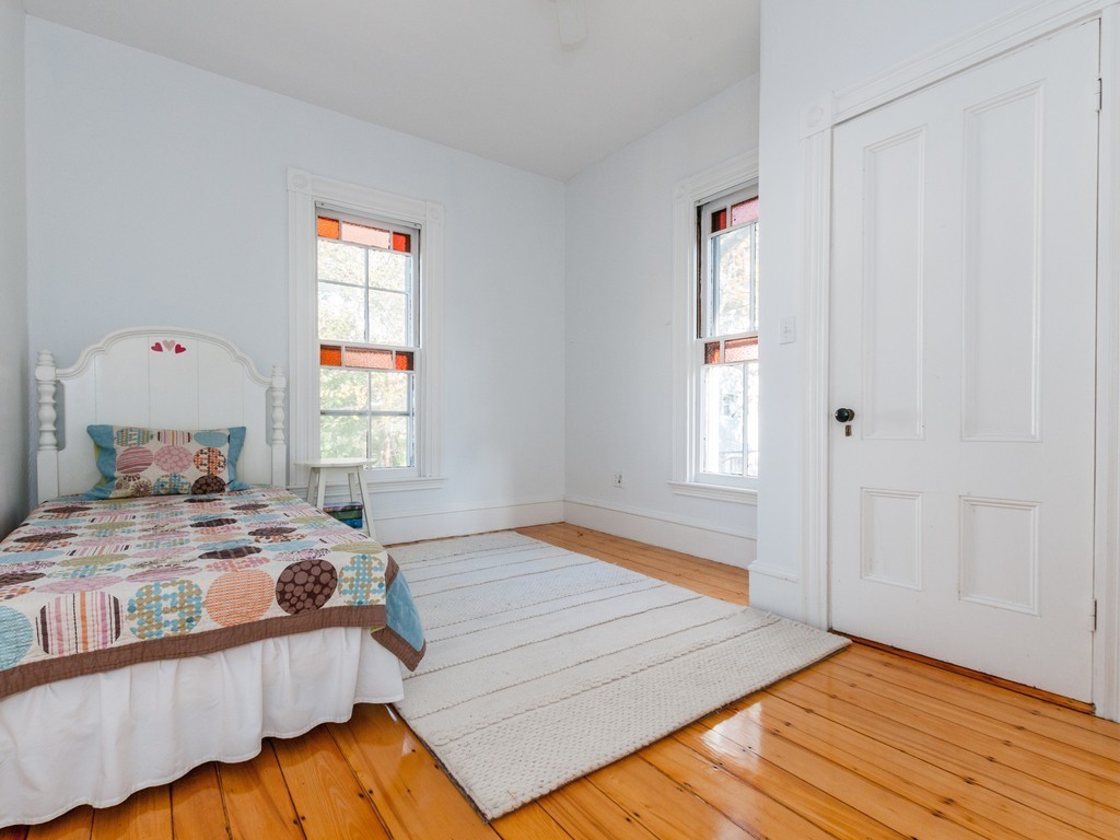 9 Cornauba Street Boston, MA 02131 - Photo 11 of 21 a bedroom with a bed and wooden floor