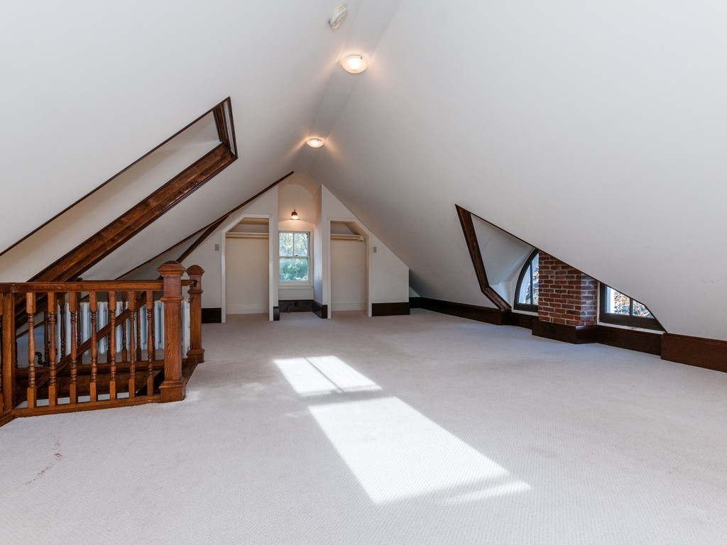9 Cornauba Street Boston, MA 02131 - Photo 14 of 21 a view of an empty room with stairs and a window
