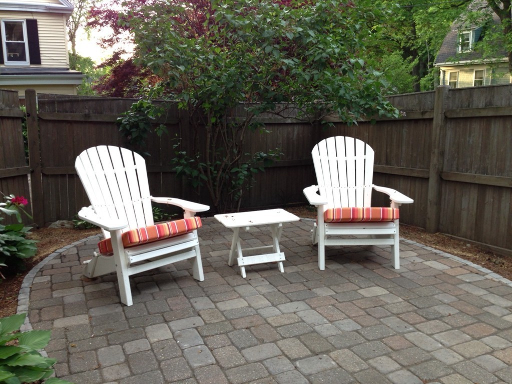 9 Cornauba Street Boston, MA 02131 - Photo 19 of 21 a wooden bench sitting in backside of a house