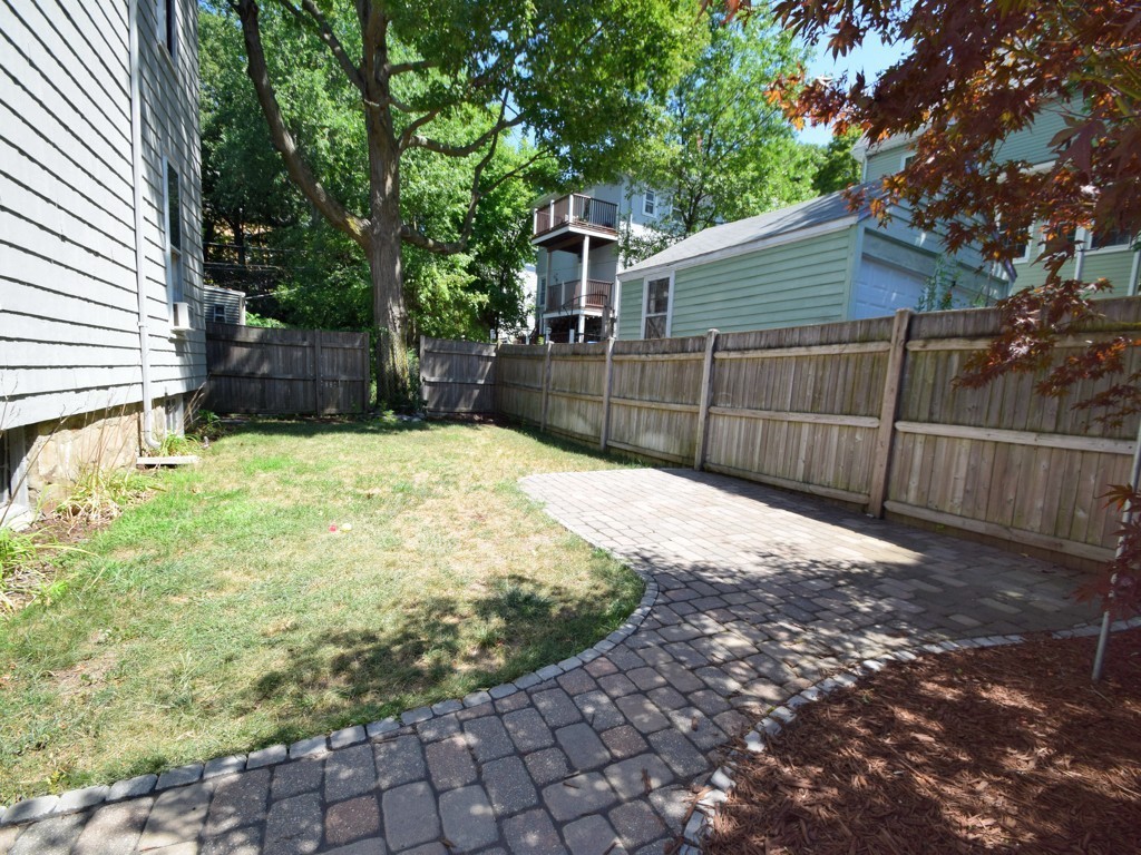 9 Cornauba Street Boston, MA 02131 - Photo 20 of 21 a view of backyard with small cabin and wooden fence