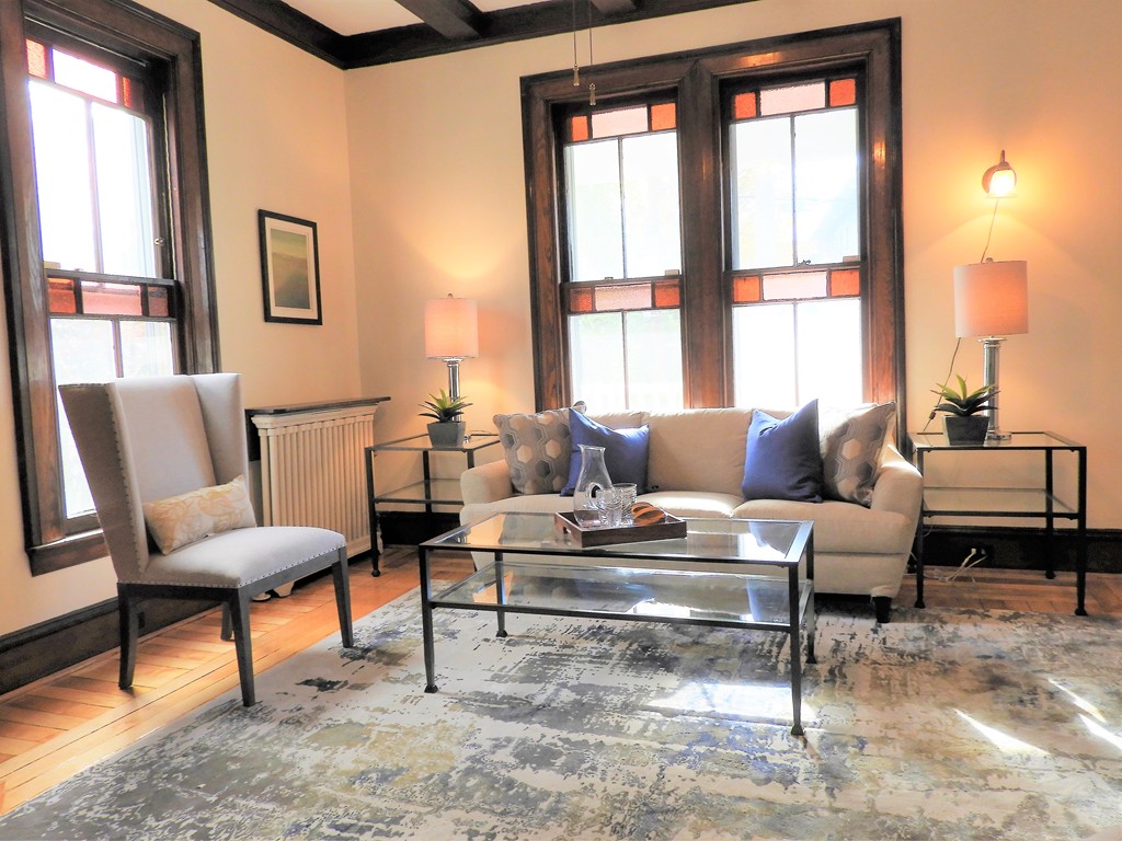 9 Cornauba Street Boston, MA 02131 - Photo 2 of 21 a living room with furniture and a large window