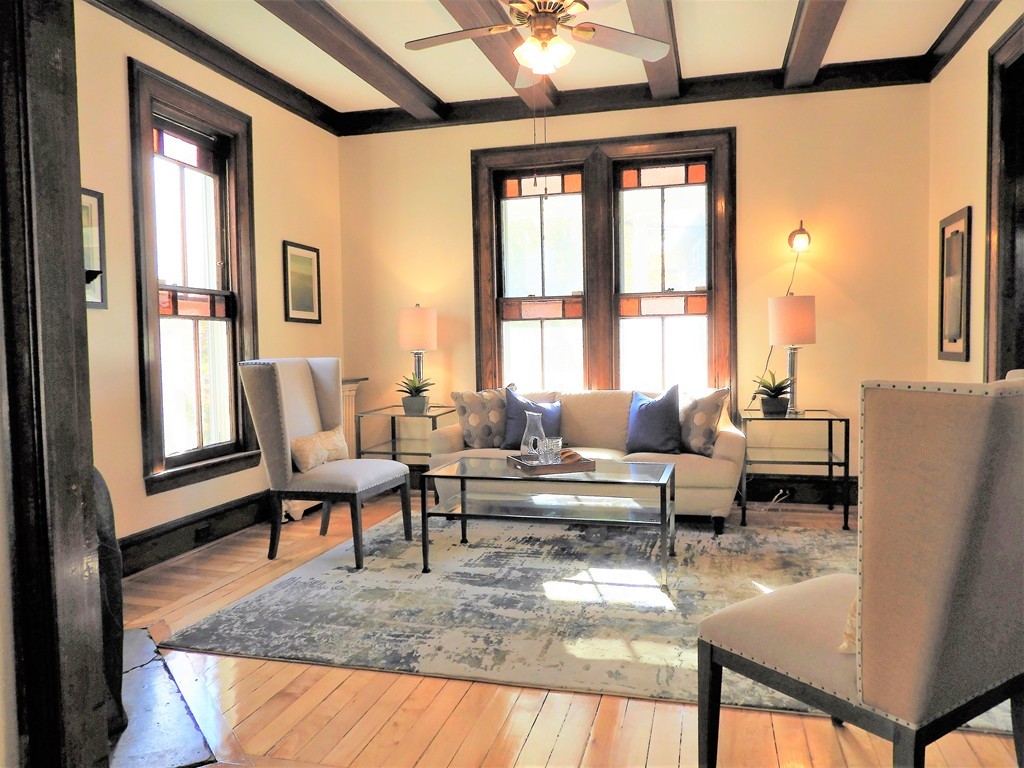 9 Cornauba Street Boston, MA 02131 - Photo 4 of 21 a living room with furniture and a large window