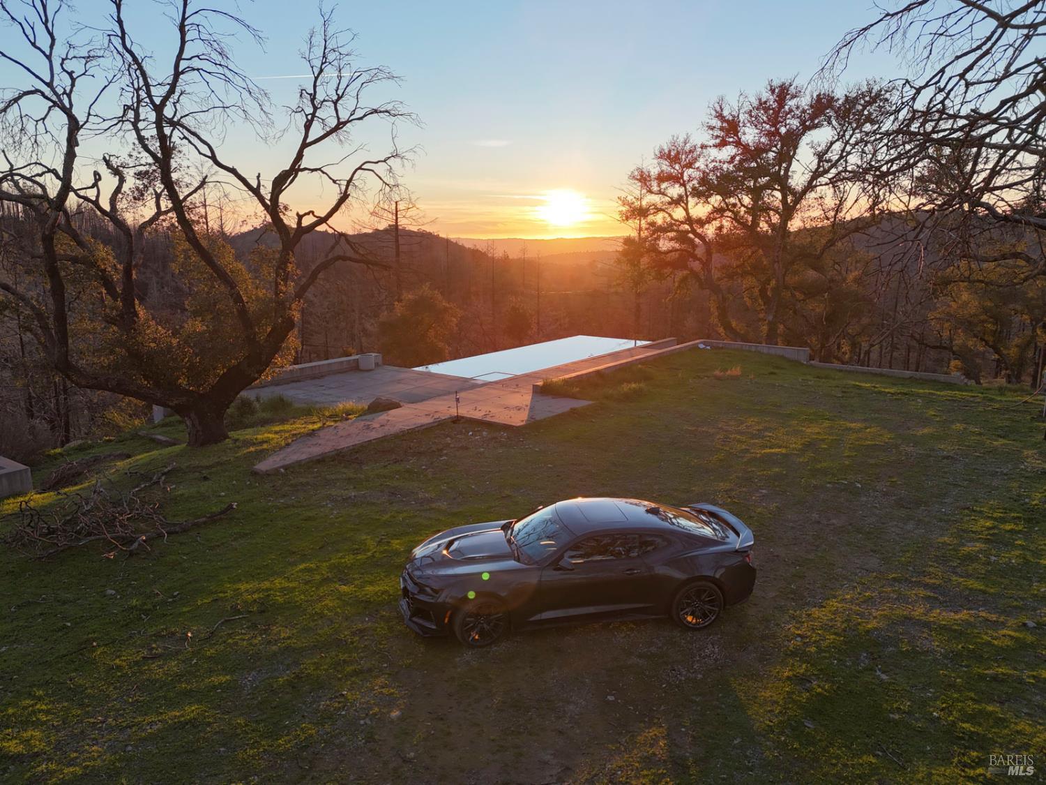 a view of a backyard of the house