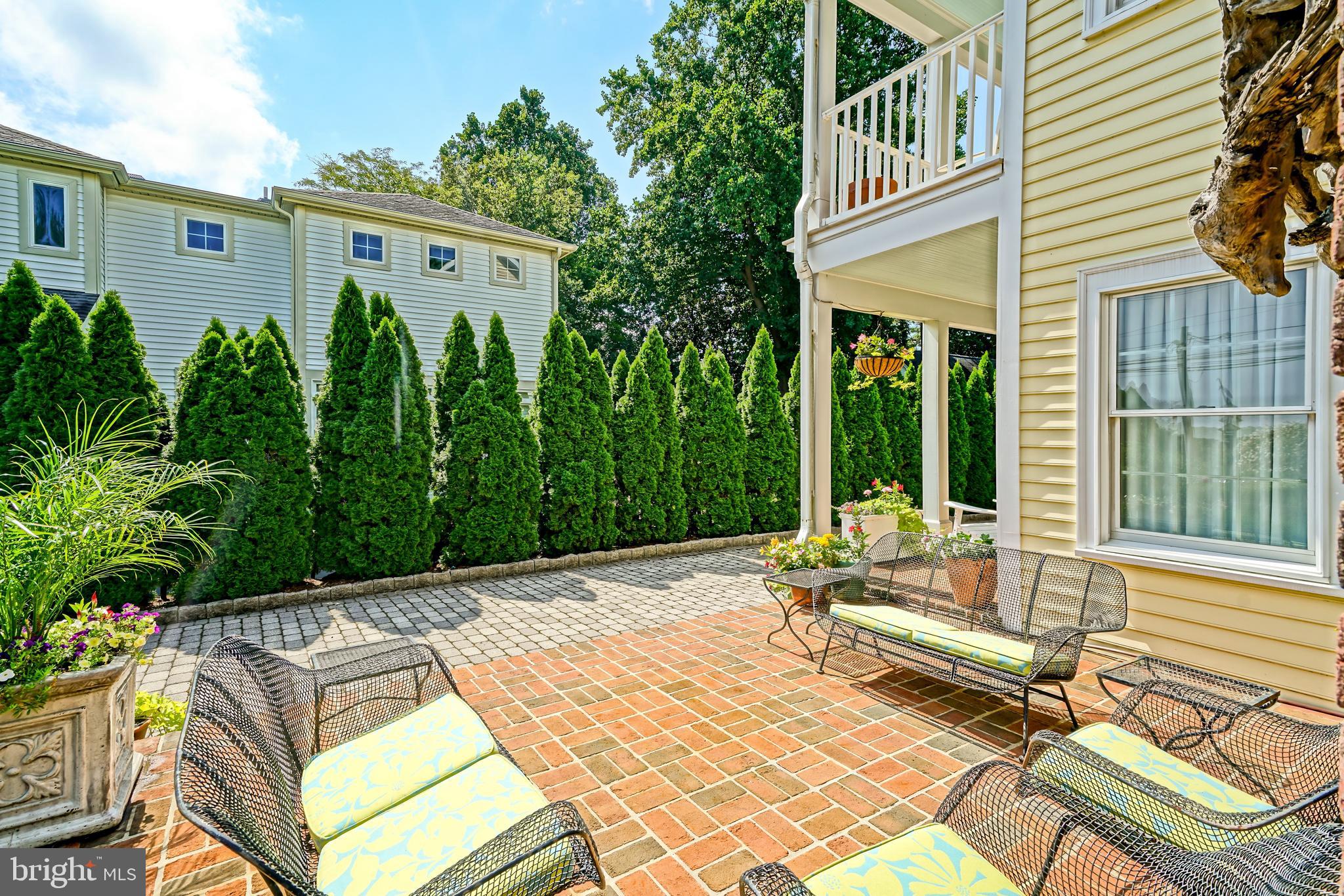 558 Pilottown Road Lewes, DE 19958 - Photo 108 of 142 a view of backyard with a table and chairs and potted plants
