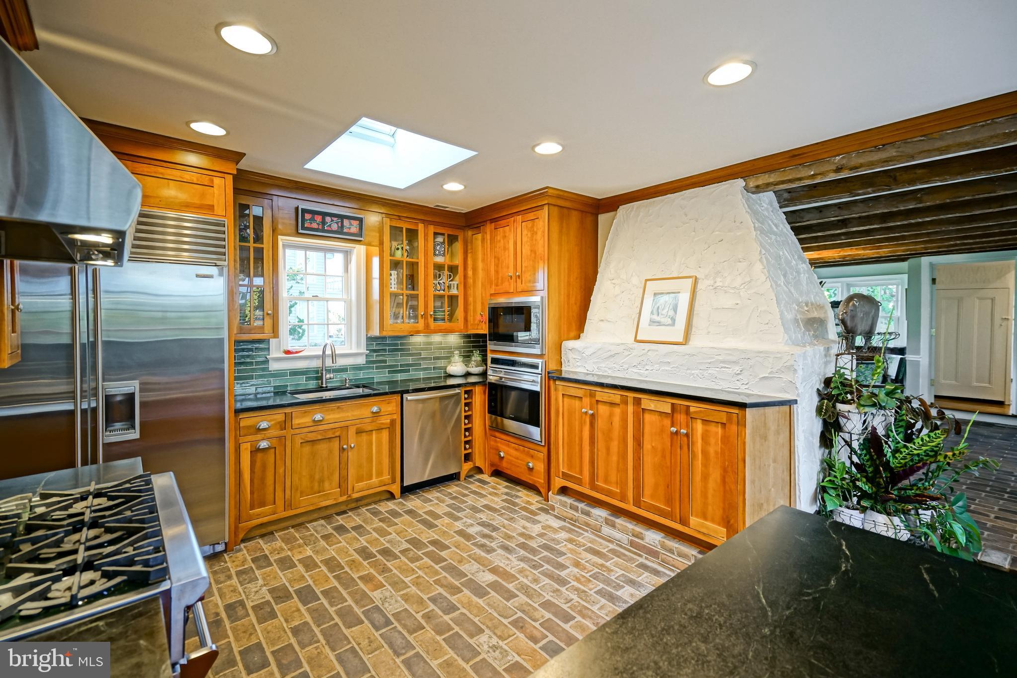 558 Pilottown Road Lewes, DE 19958 - Photo 32 of 142 a kitchen with stainless steel appliances granite countertop sink stove and refrigerator
