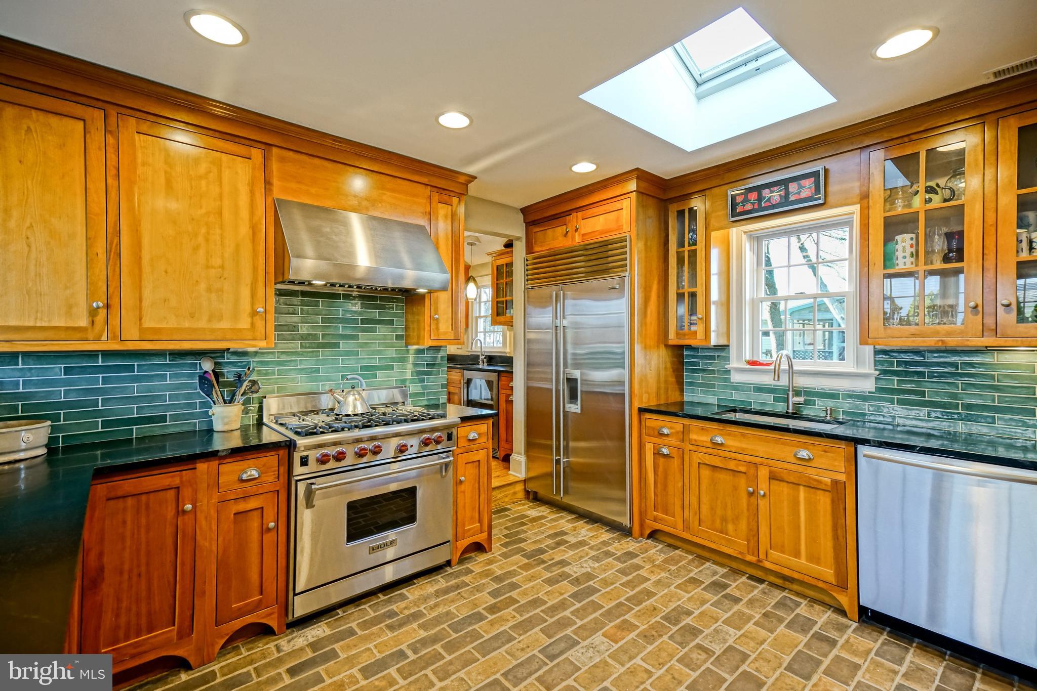 558 Pilottown Road Lewes, DE 19958 - Photo 33 of 142 a kitchen with stainless steel appliances granite countertop a stove and a sink