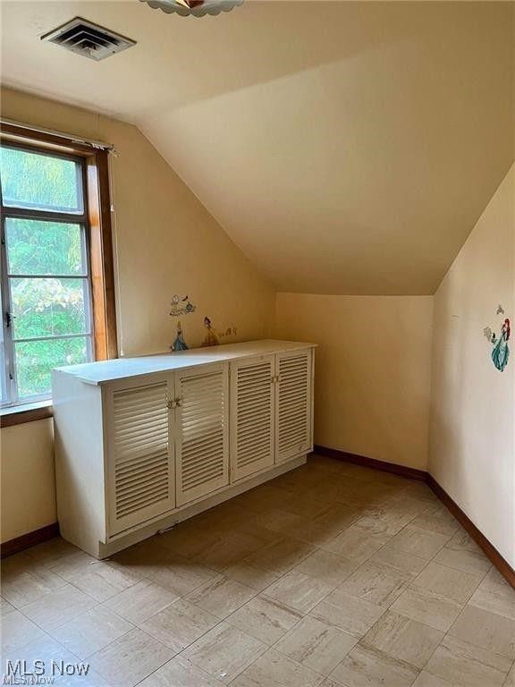 8581 Fair Road Strongsville, OH 44149 - Photo 19 of 20 Bonus room with lofted ceiling and baseboards