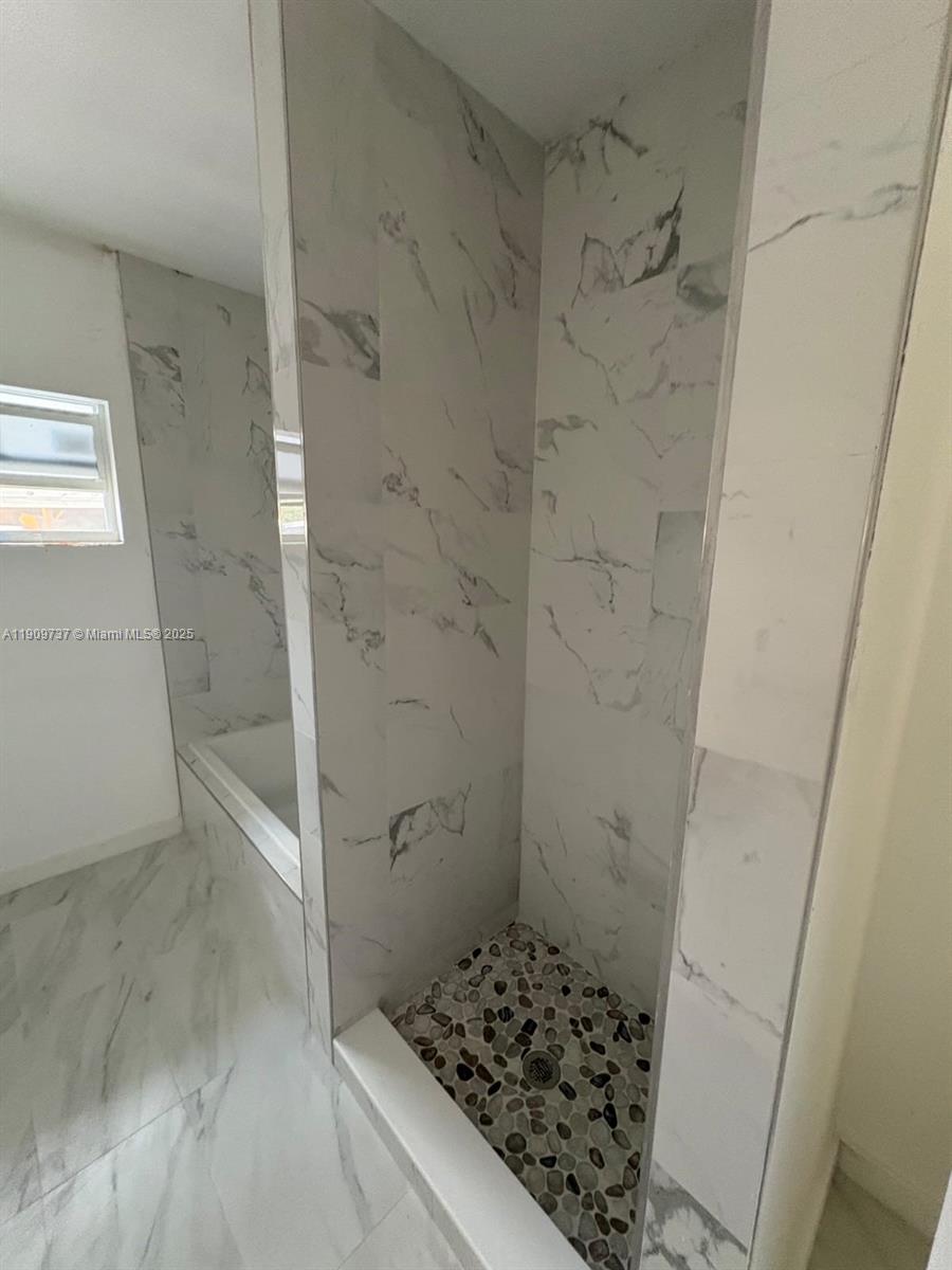 2121 Rutland Street Opa-Locka, FL 33054 - Photo 3 of 5 a bathroom with a shower