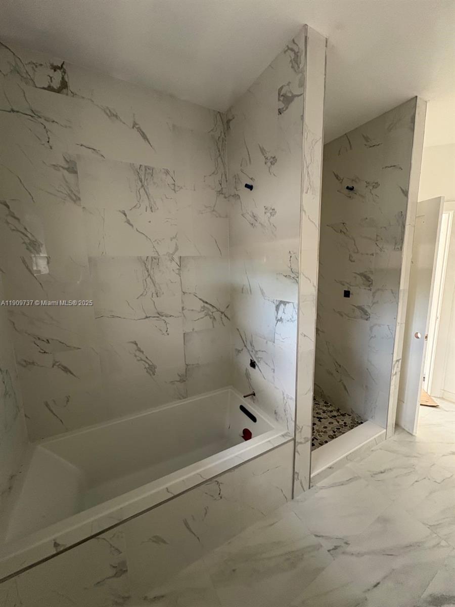 2121 Rutland Street Opa-Locka, FL 33054 - Photo 5 of 5 a bathroom with a bathtub